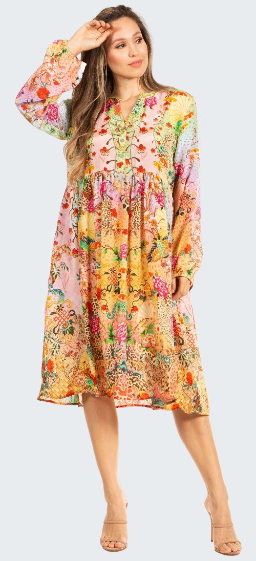 Woman wearing a colorful floral dress on a white background