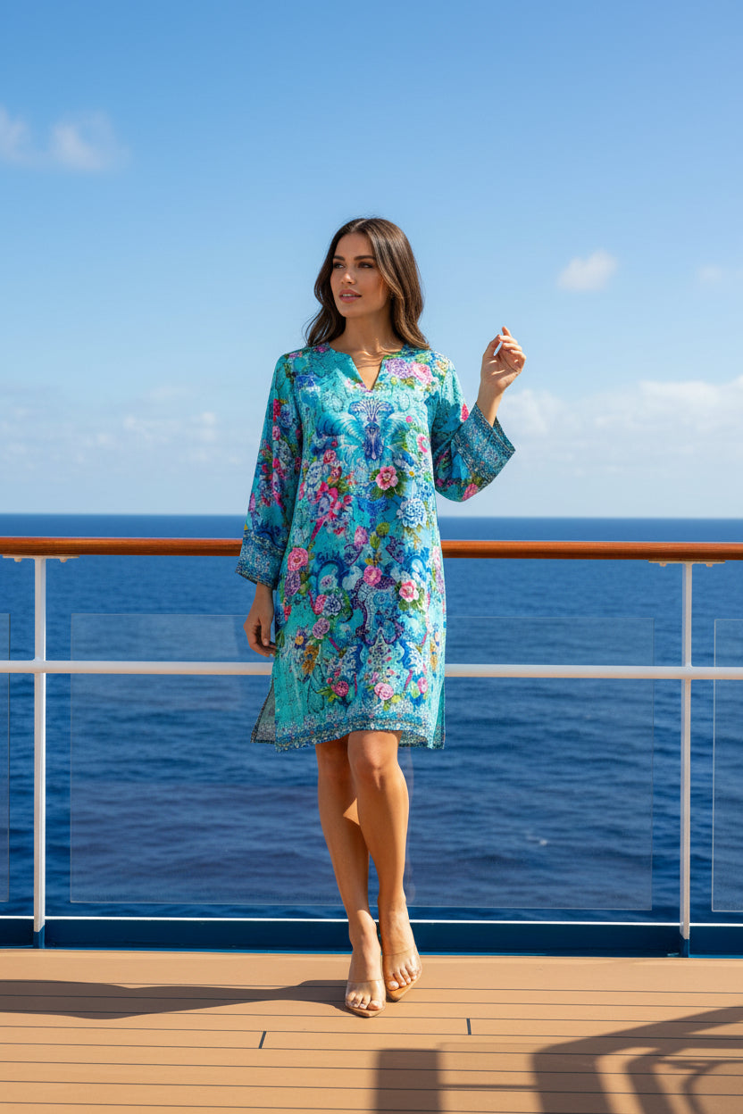 Woman wearing a colorful floral dress on a white background