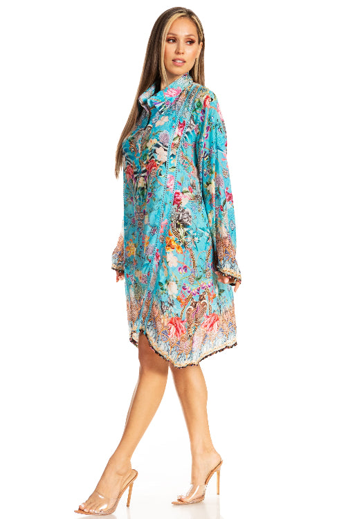 Woman wearing a colorful floral dress on a white background