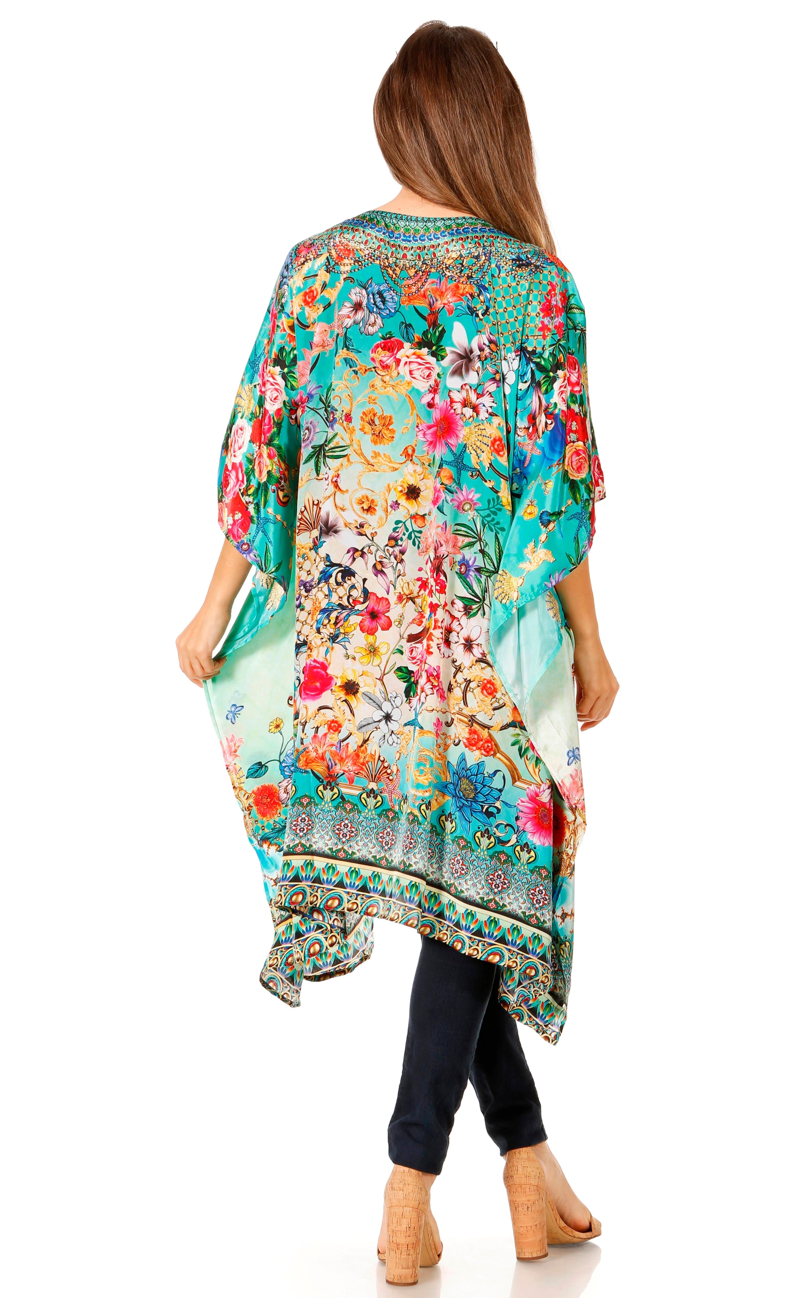 Woman wearing a colorful floral kimono on a white background