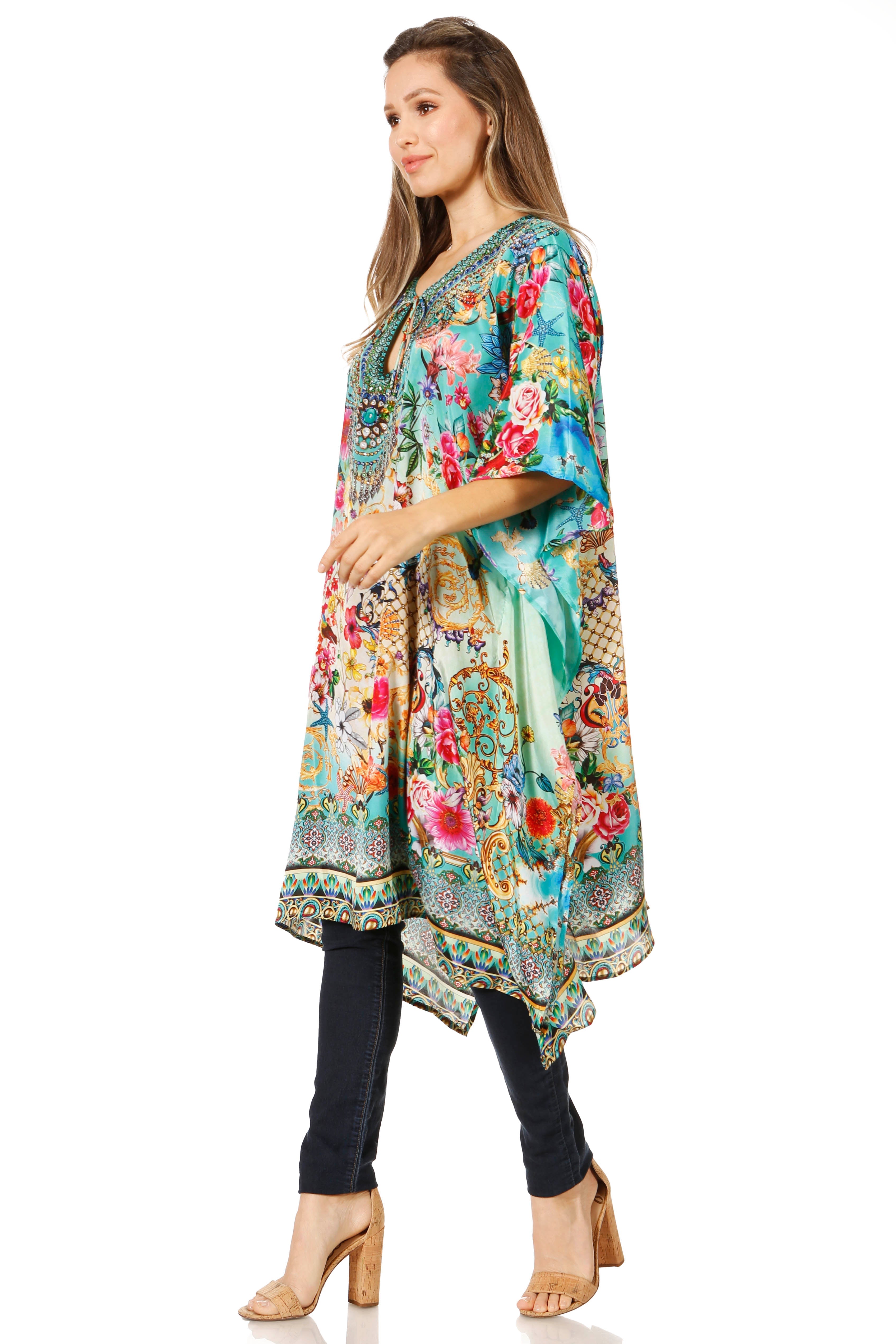 Woman wearing a colorful floral kimono-style garment on a white background