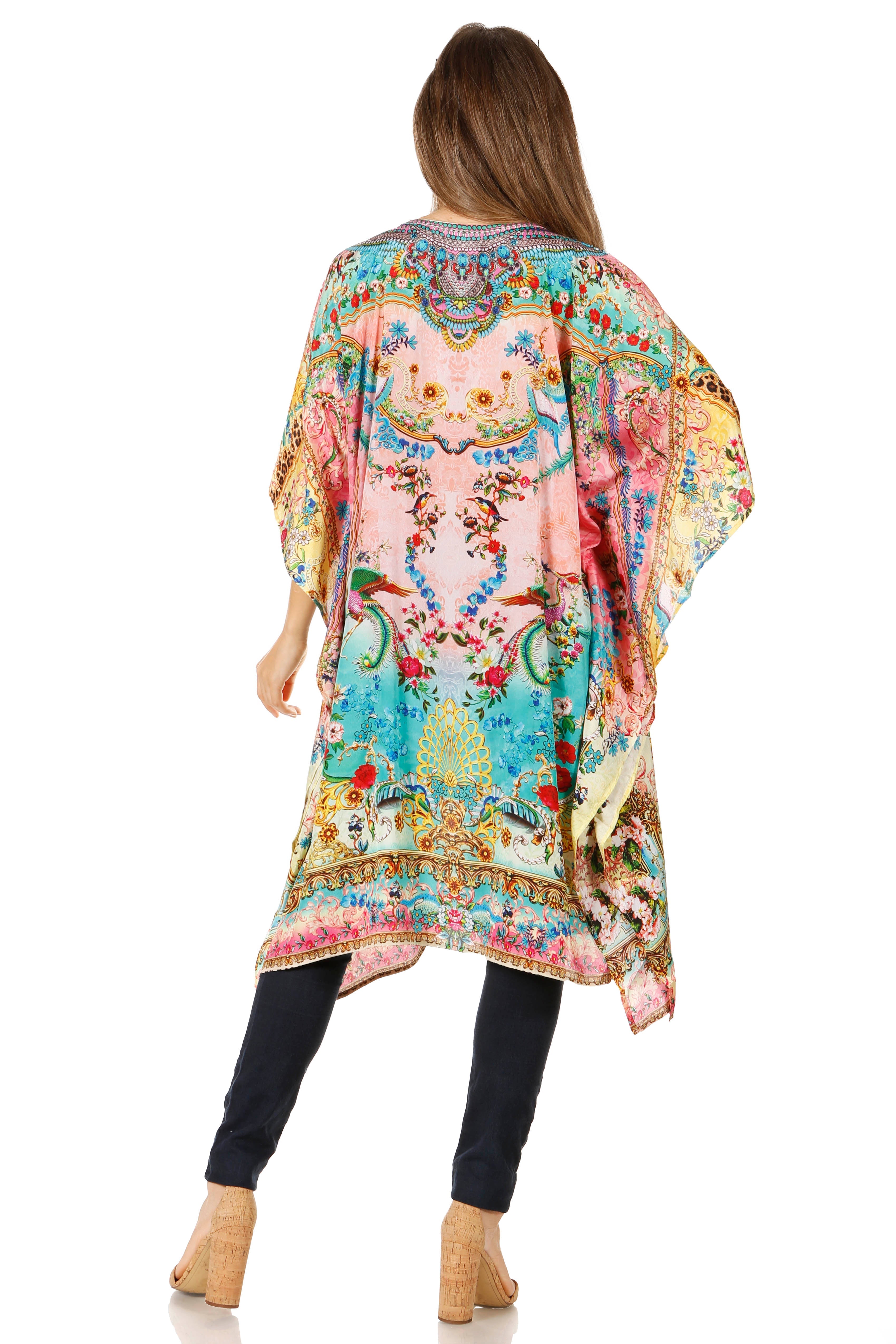Woman wearing a colorful patterned kimono-style garment on a white background