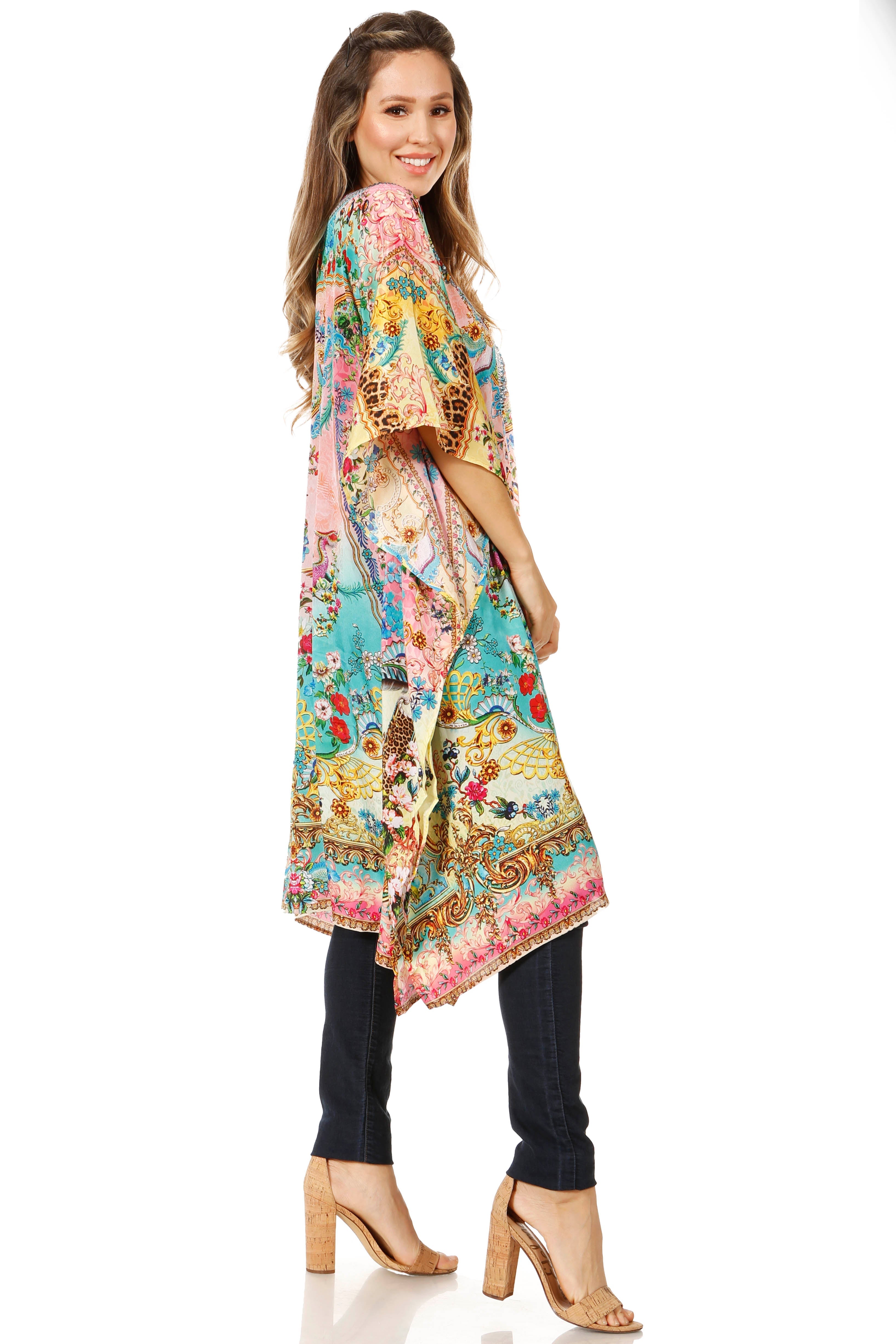 Woman wearing a colorful floral kimono-style top on a white background