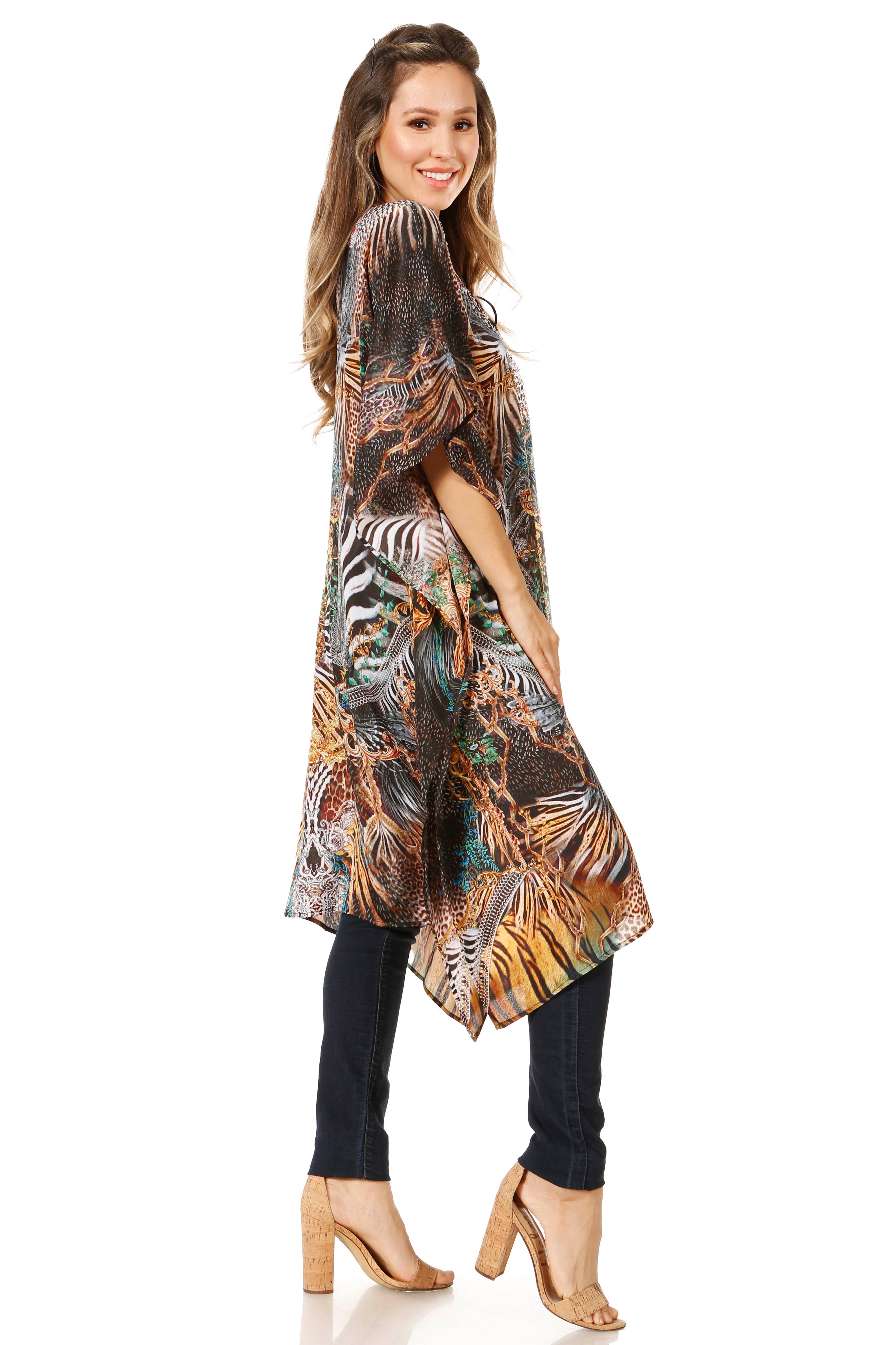 Woman wearing a patterned poncho on a white background