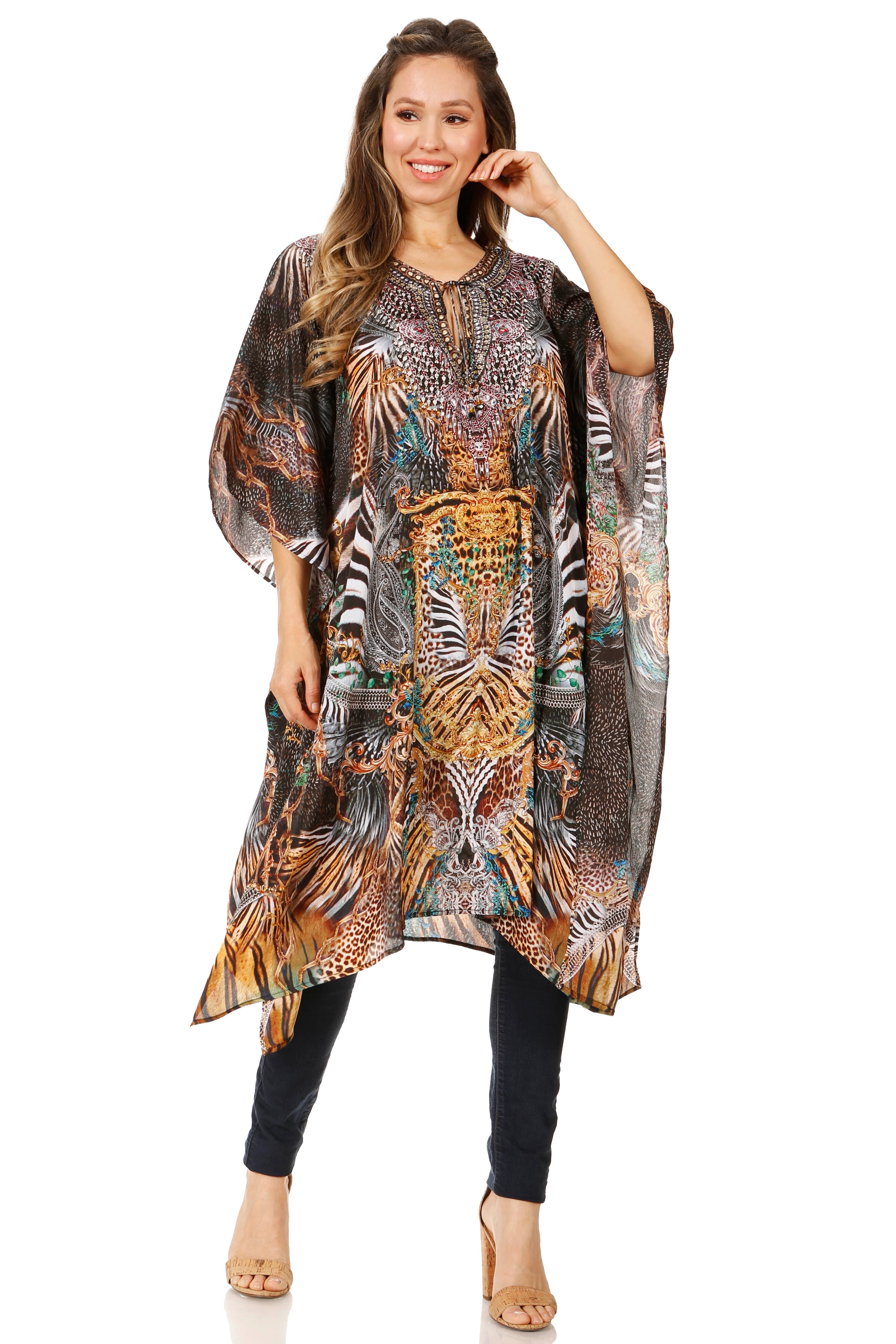 Woman wearing a patterned kaftan over a black outfit on a white background