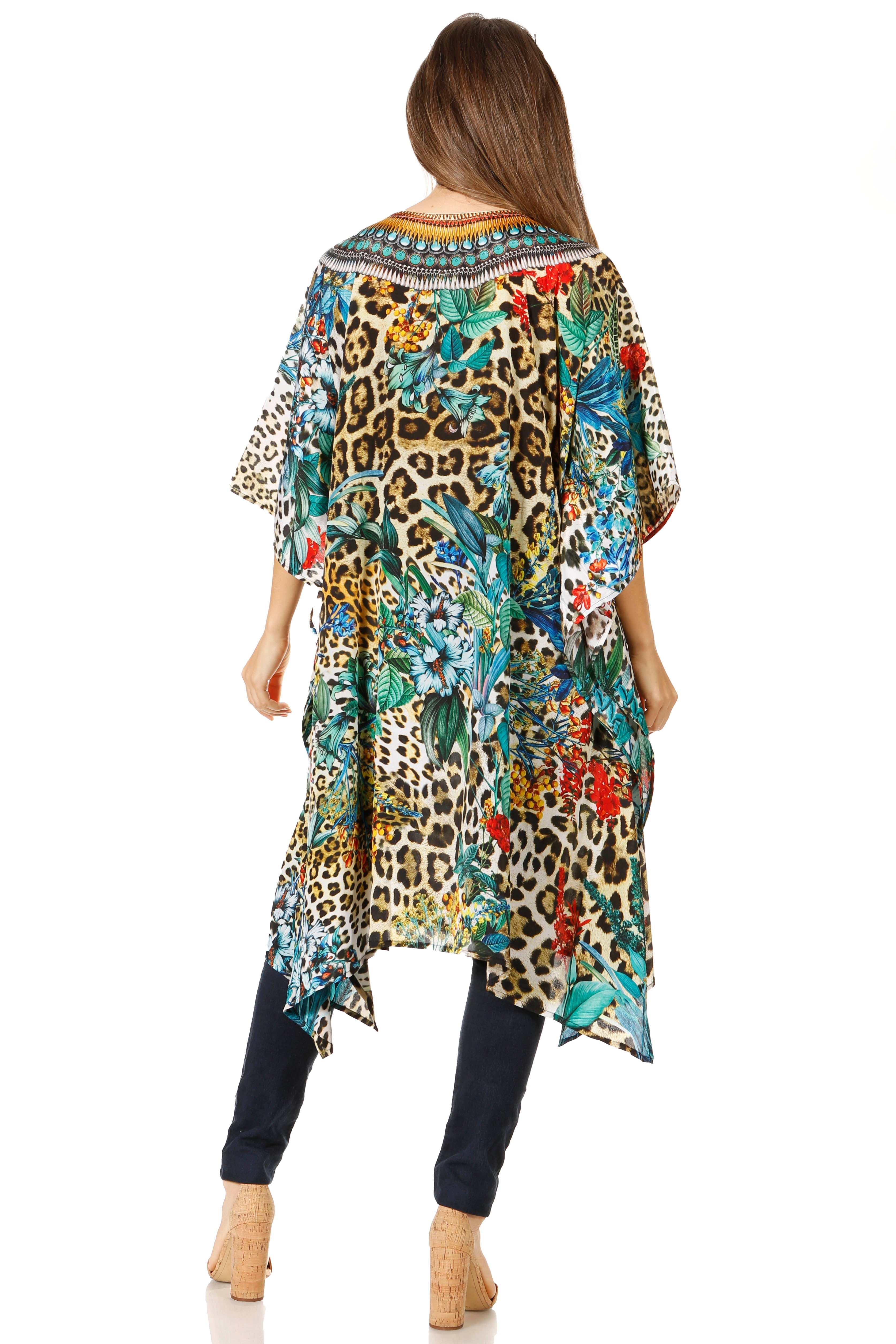 Woman wearing a colorful floral and leopard print dress on a white background