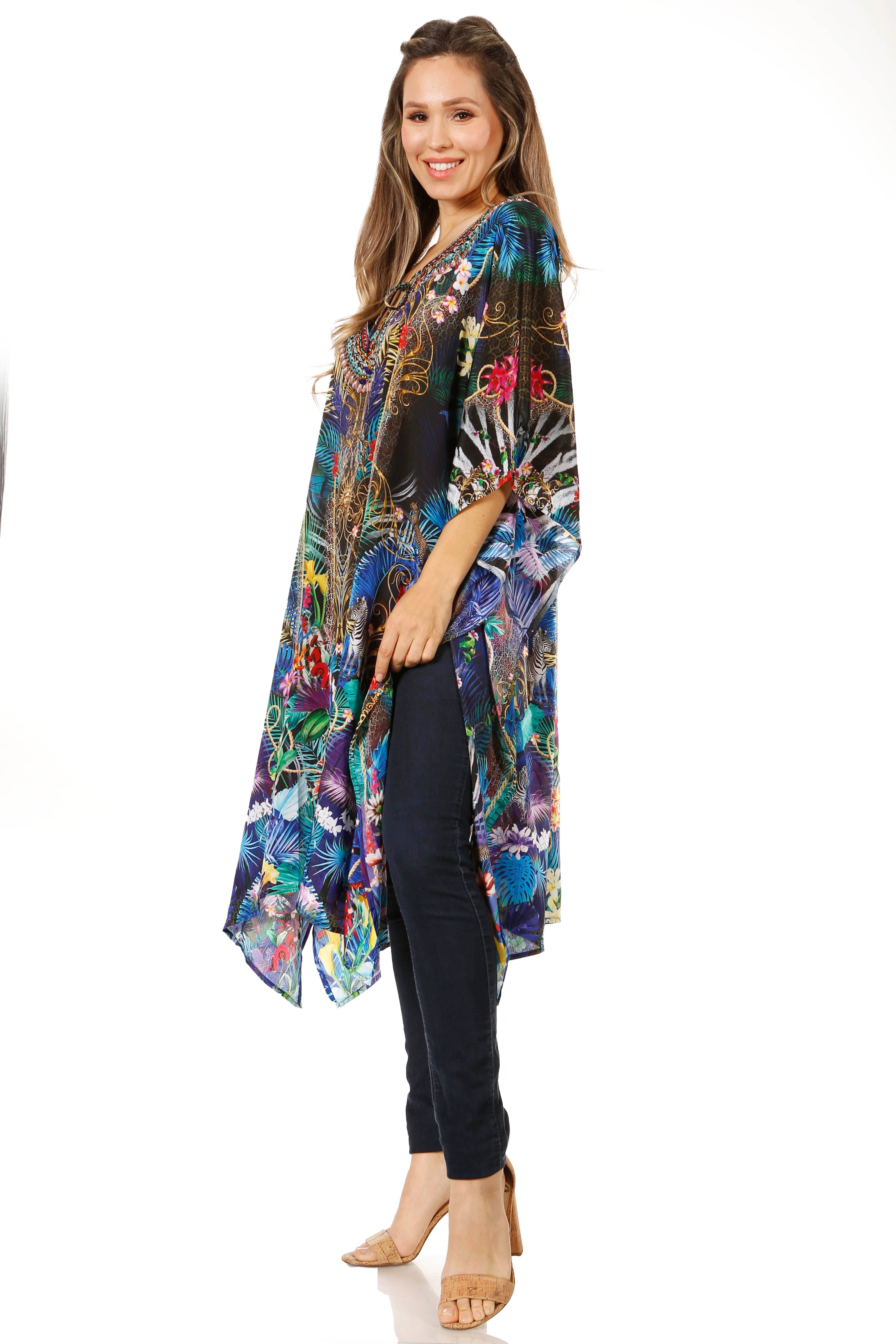 Woman wearing a colorful patterned kimono over a black outfit on a white background