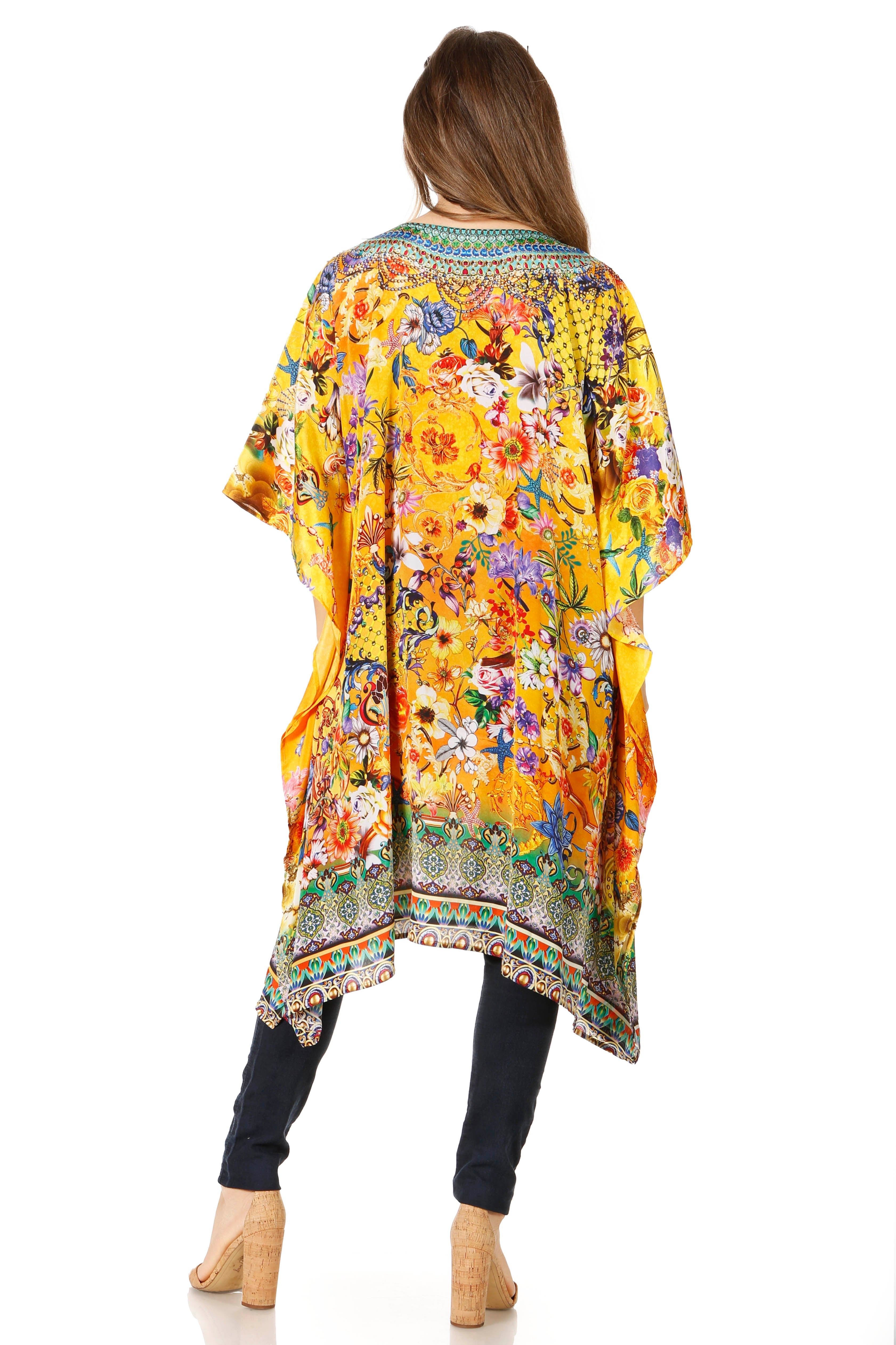 Woman wearing a colorful floral kimono on a white background
