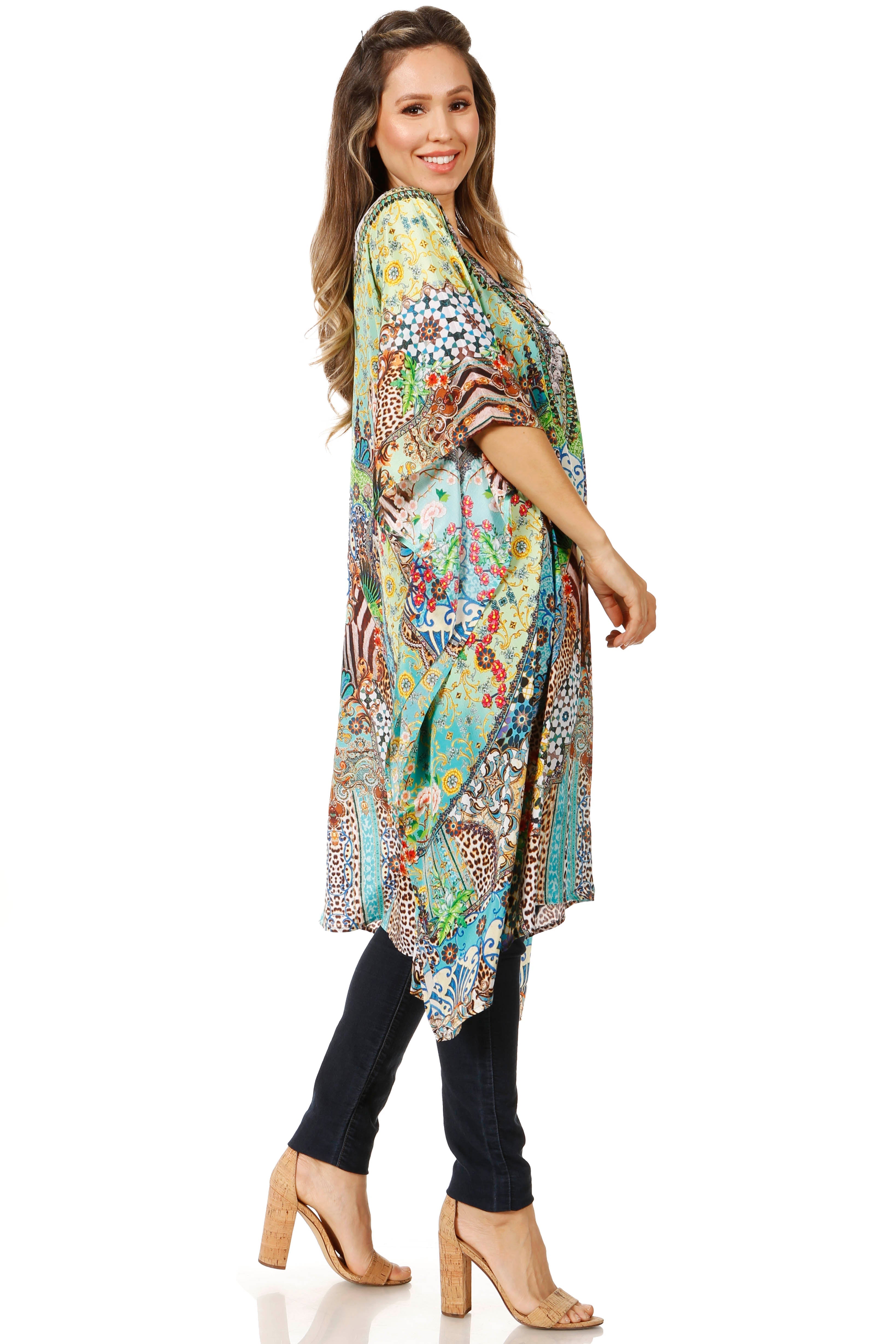 Woman wearing a colorful patterned kimono over a black outfit on a white background