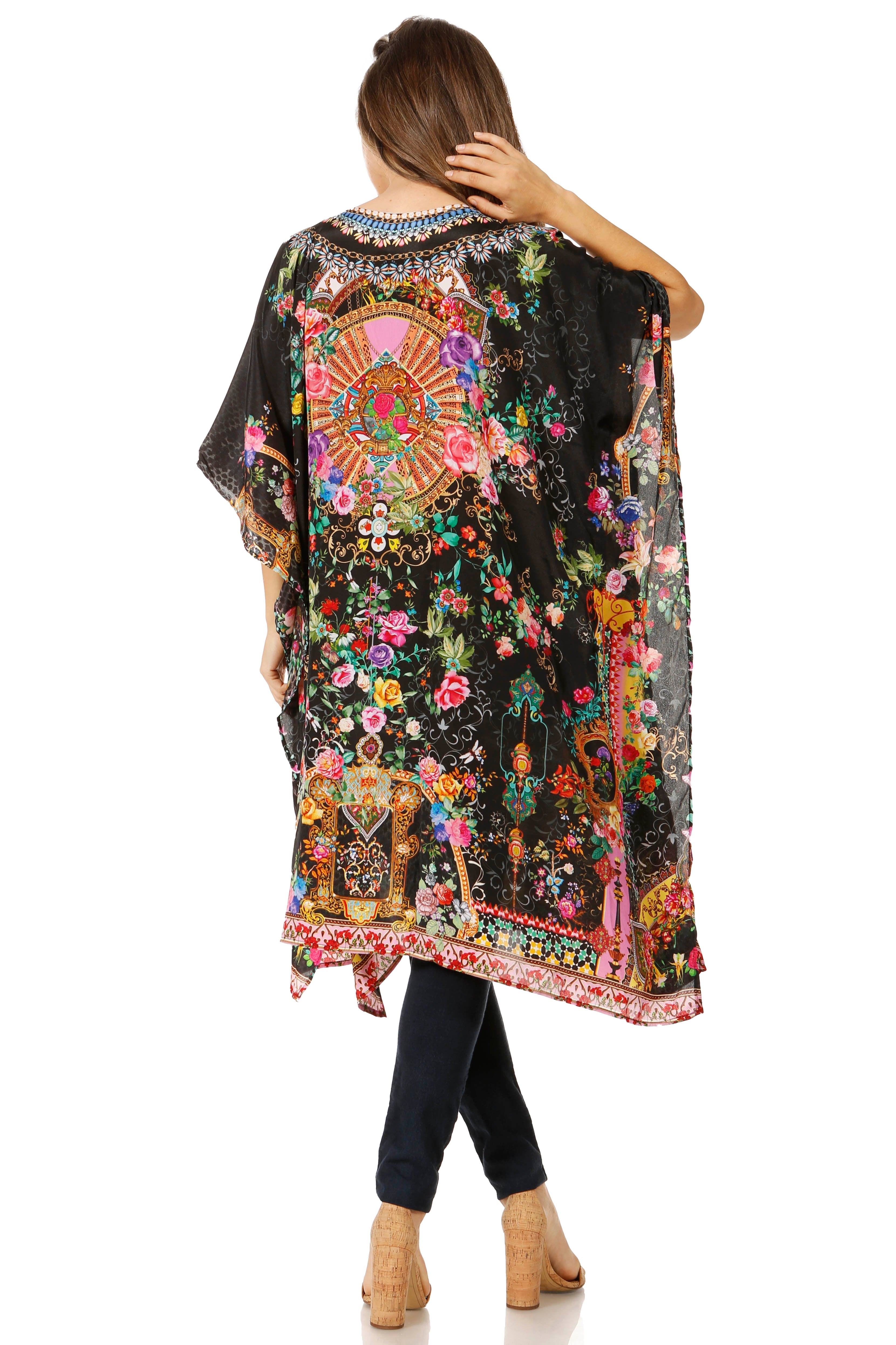Woman wearing a colorful, patterned kimono-style garment on a white background