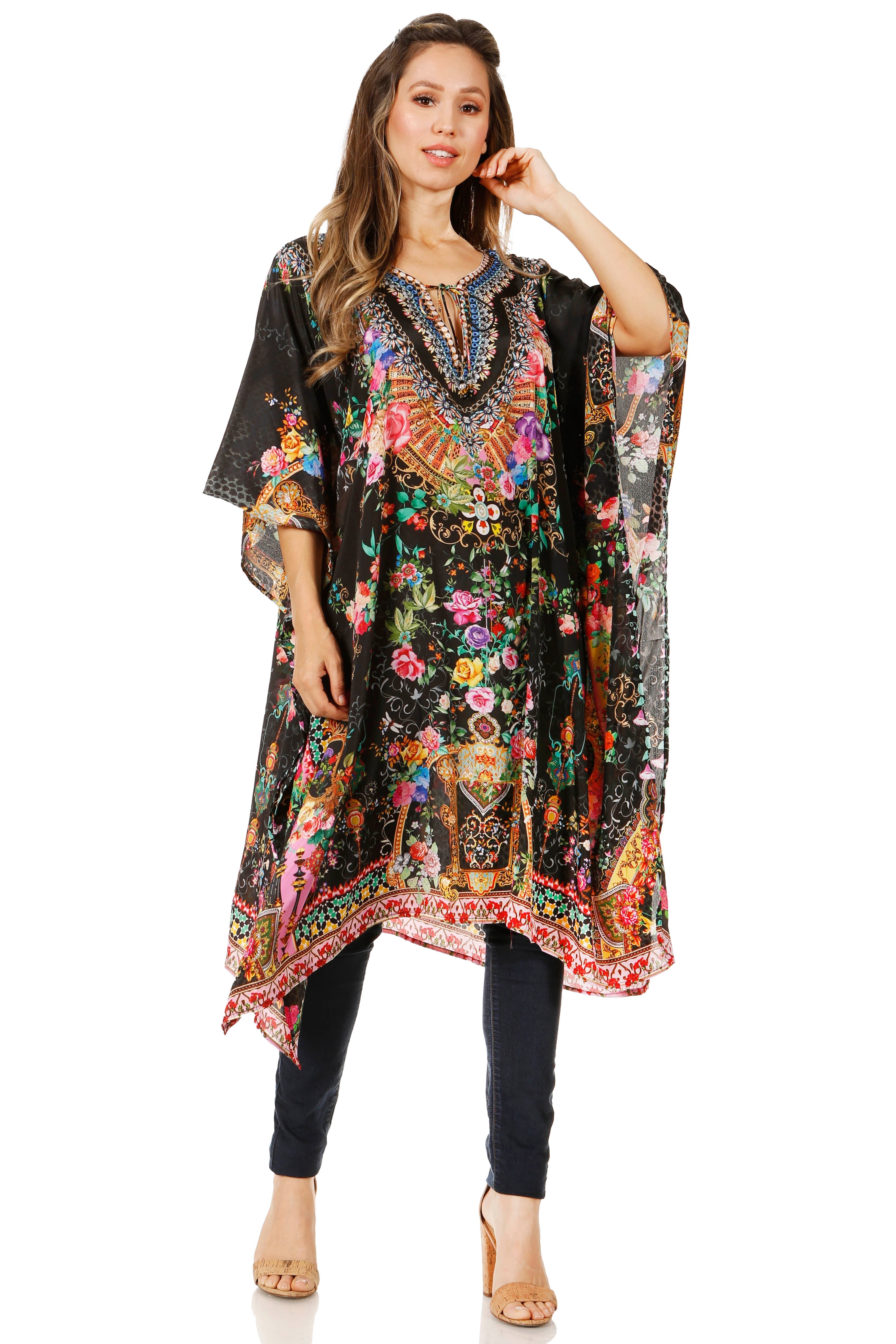 Woman wearing a colorful embroidered dress with a black background