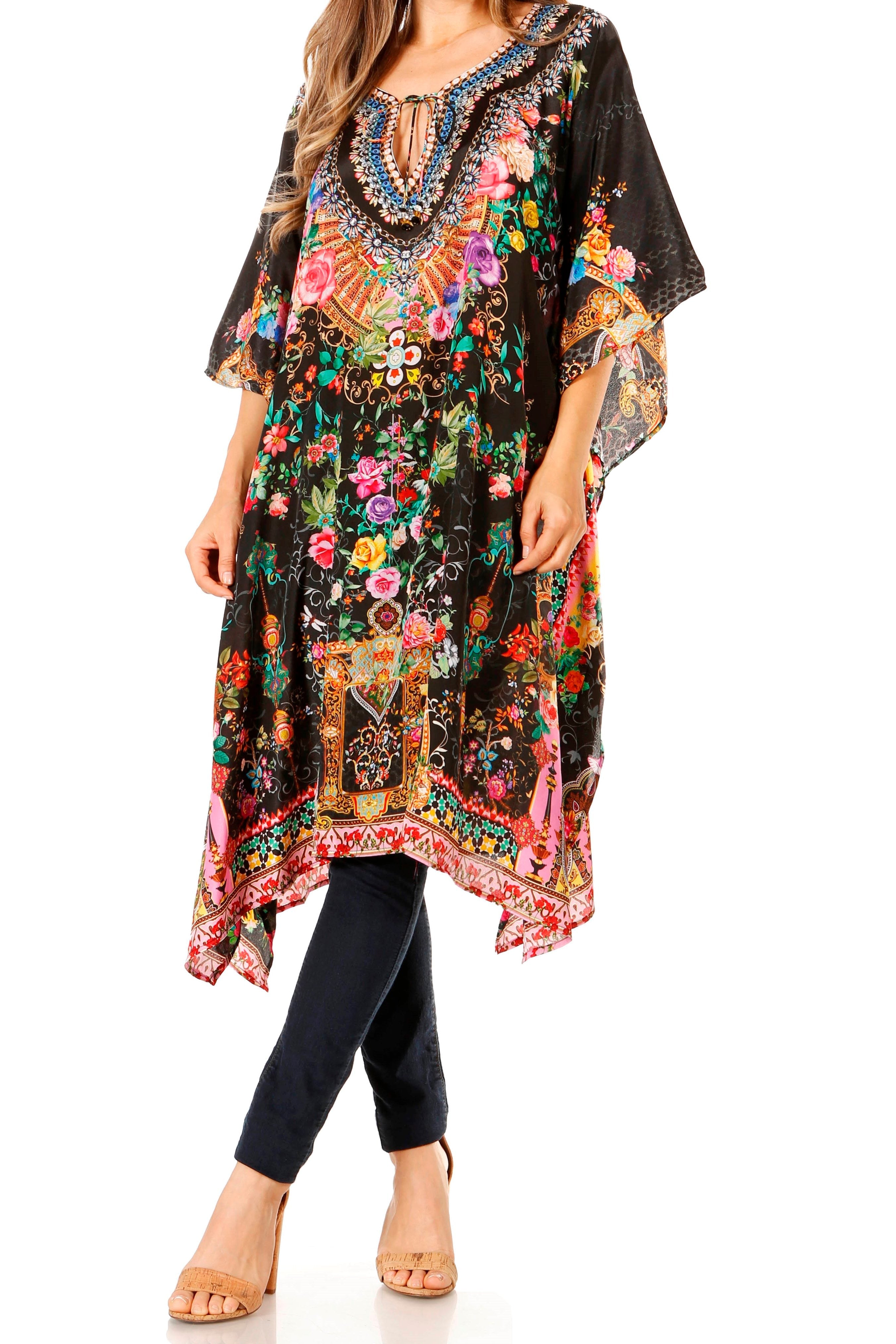 Woman wearing a colorful floral and paisley patterned dress on a white background