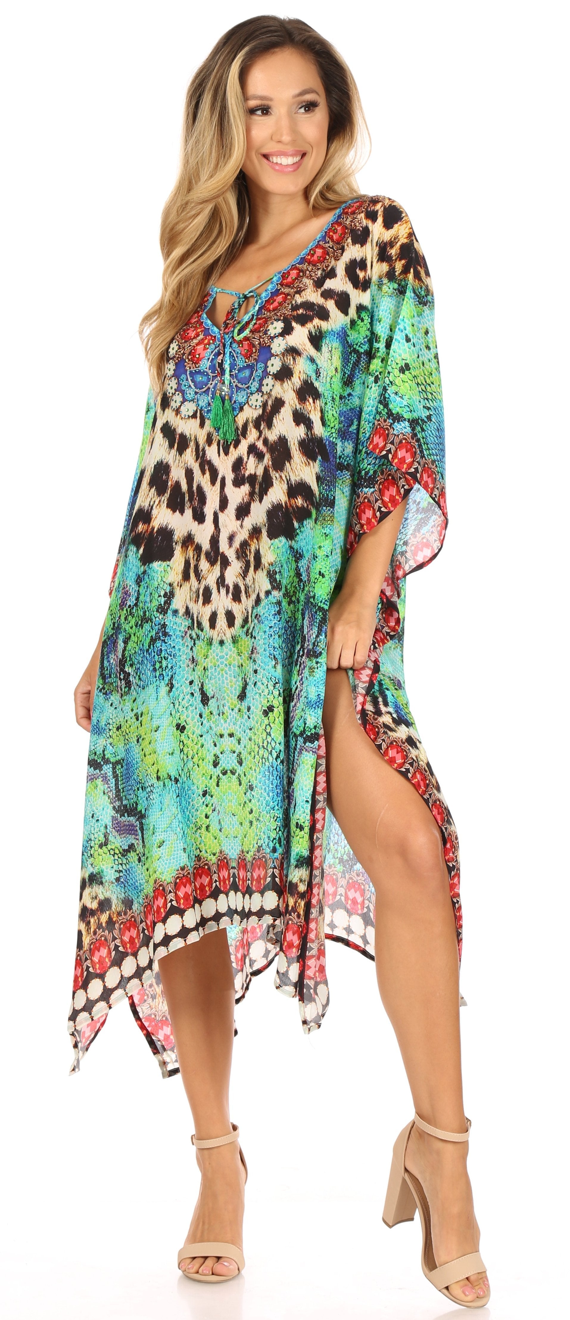 Woman wearing a colorful patterned dress with a slit on a white background