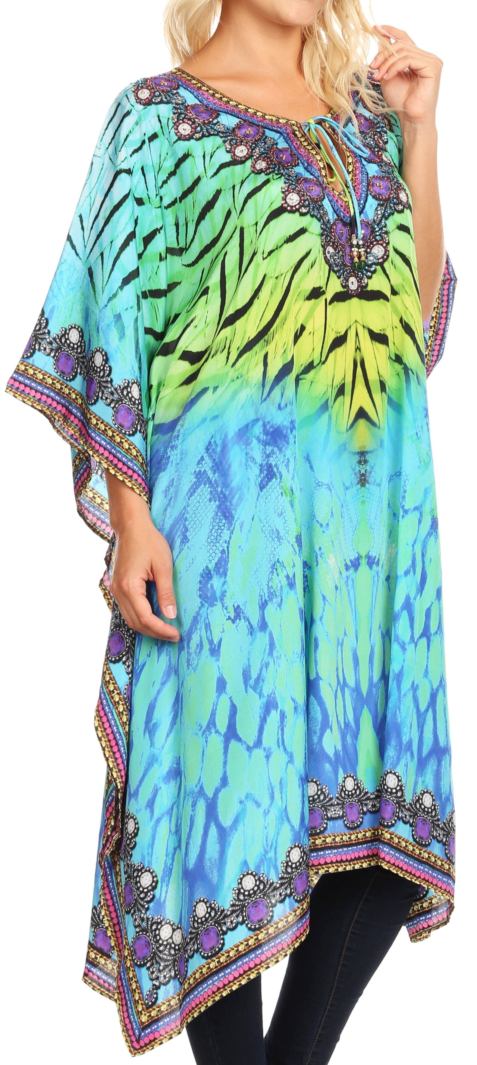 Colorful tie-dye dress with floral patterns and embellishments on a model.