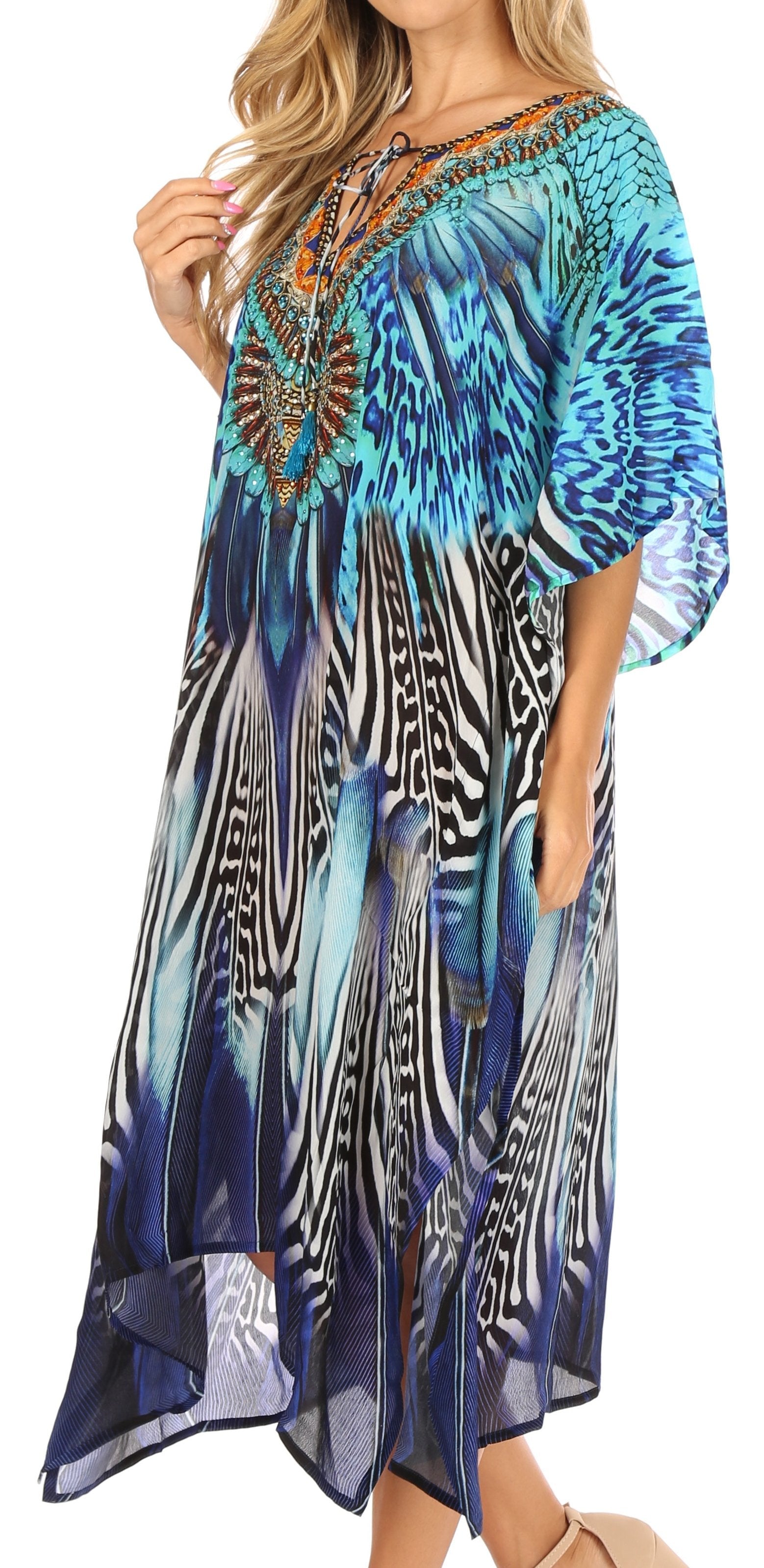 Woman wearing a colorful patterned dress with zebra and abstract designs.