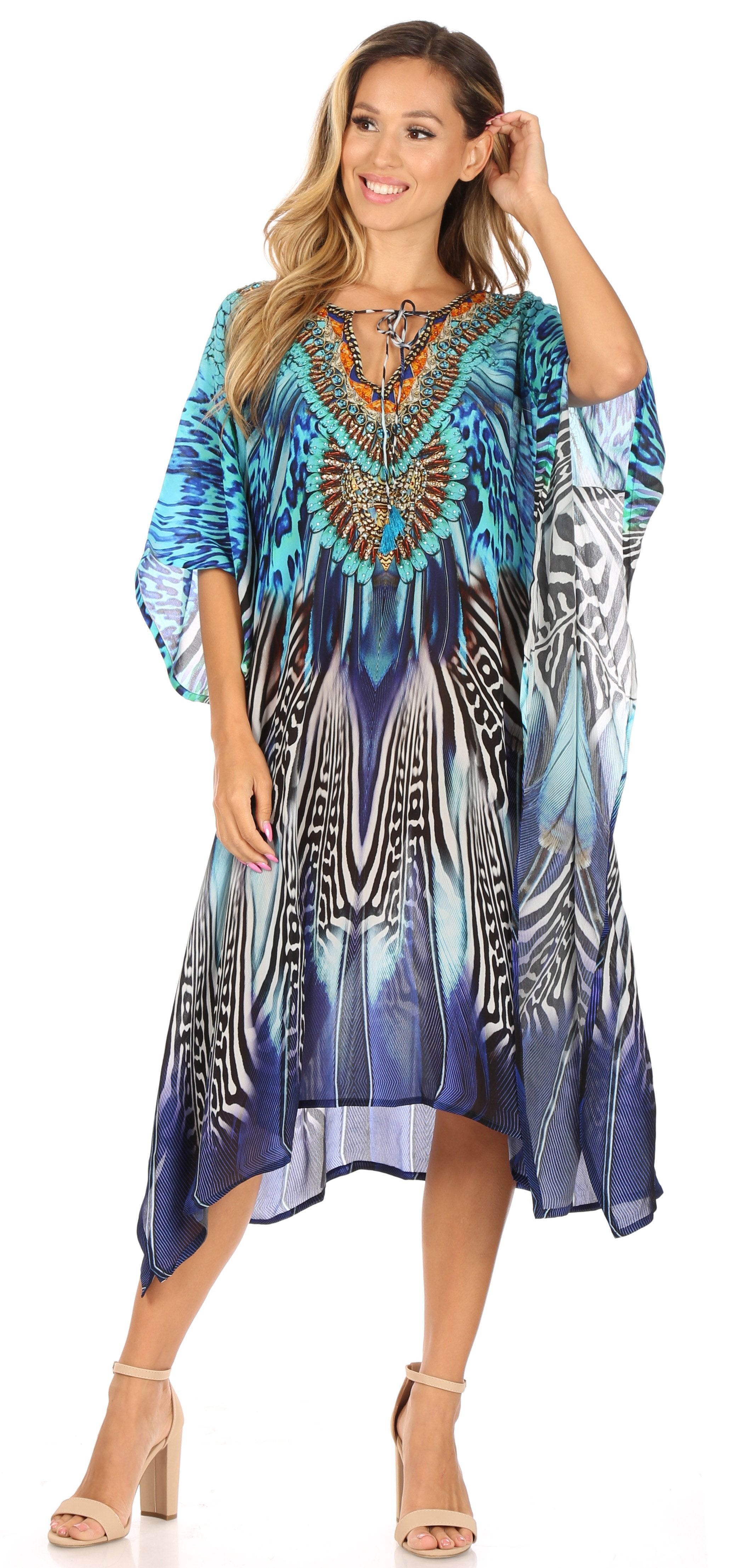 Woman wearing a blue patterned dress on a white background