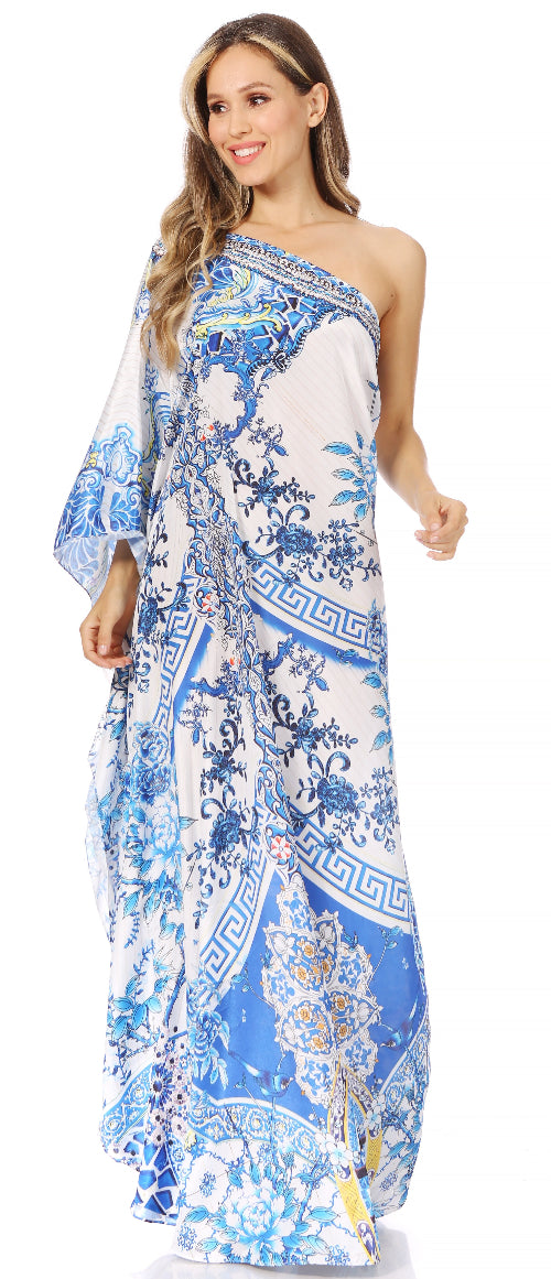 Woman wearing a floral one-shoulder dress with blue and white patterns on a white background