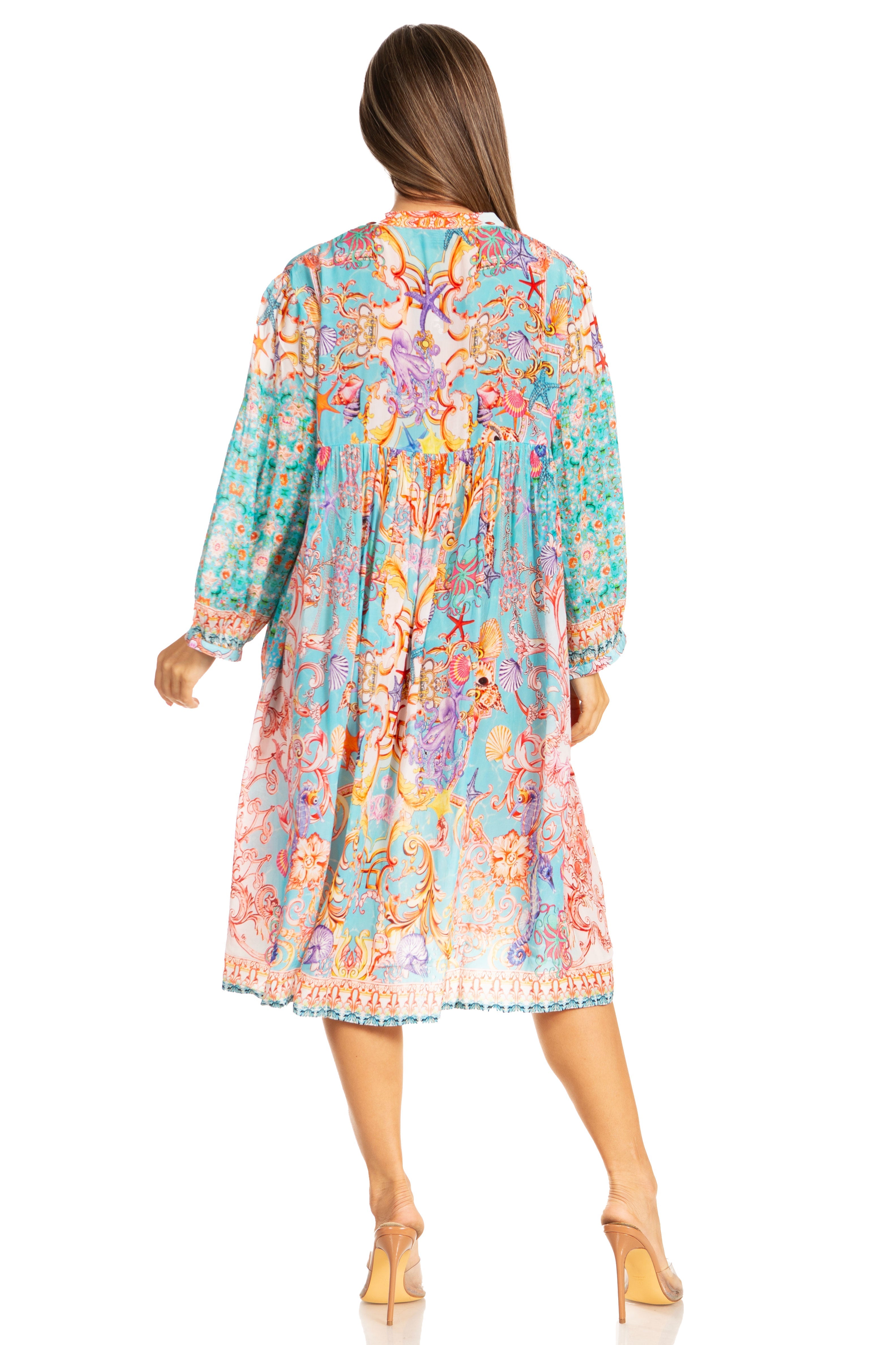 Woman wearing a colorful patterned dress on a white background