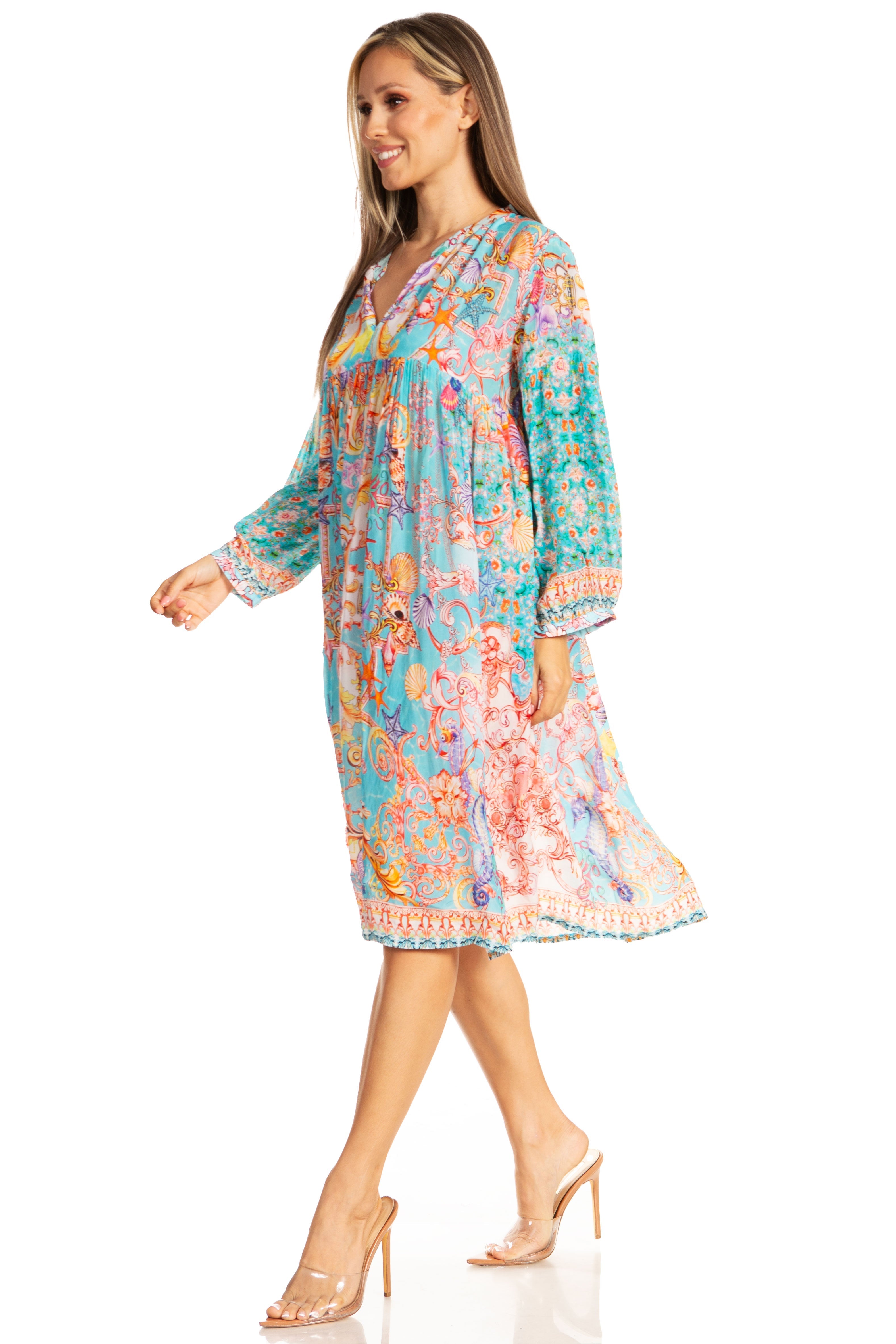 Woman wearing a colorful floral dress on a white background