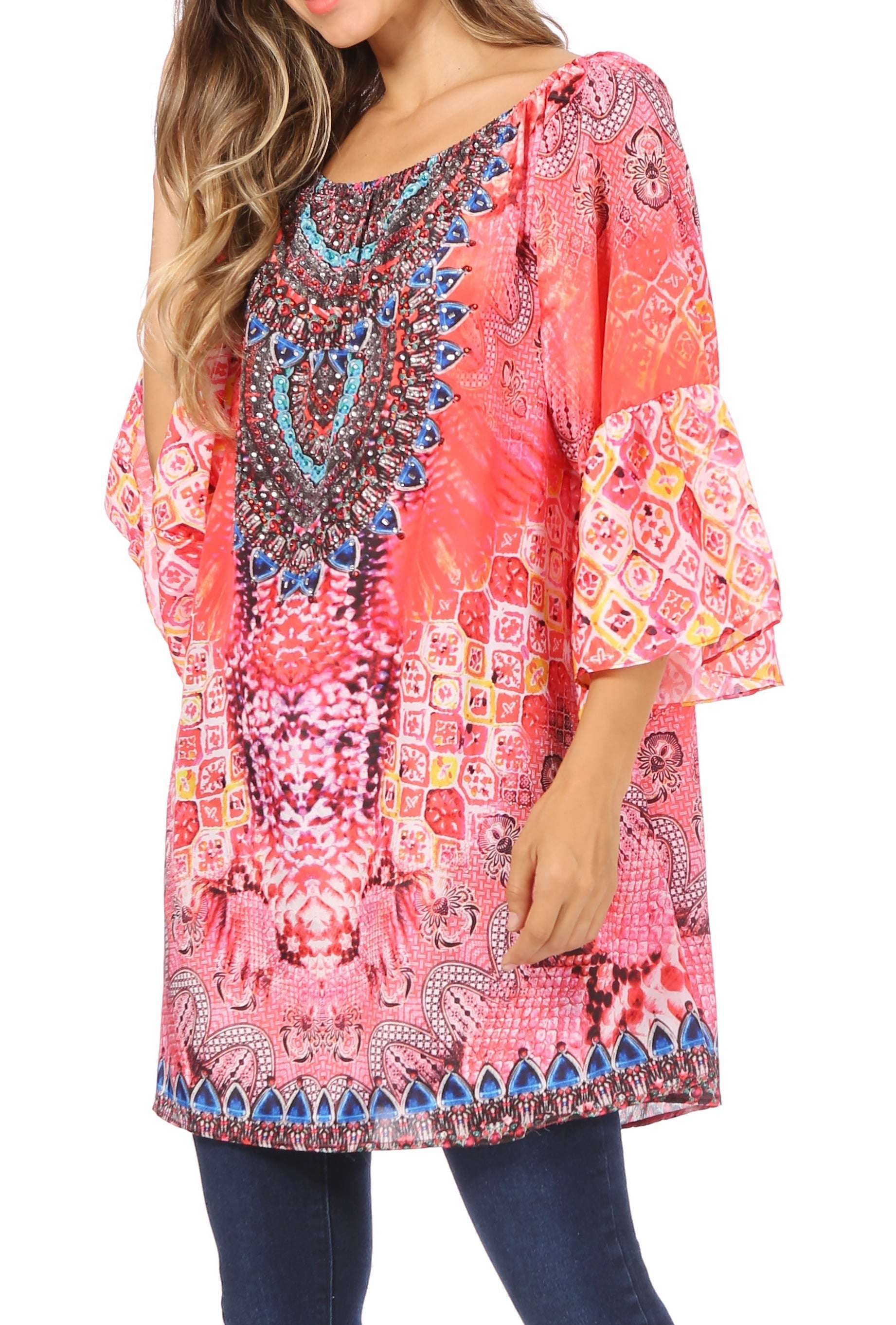 Woman wearing a colorful patterned blouse with bell sleeves on a white background