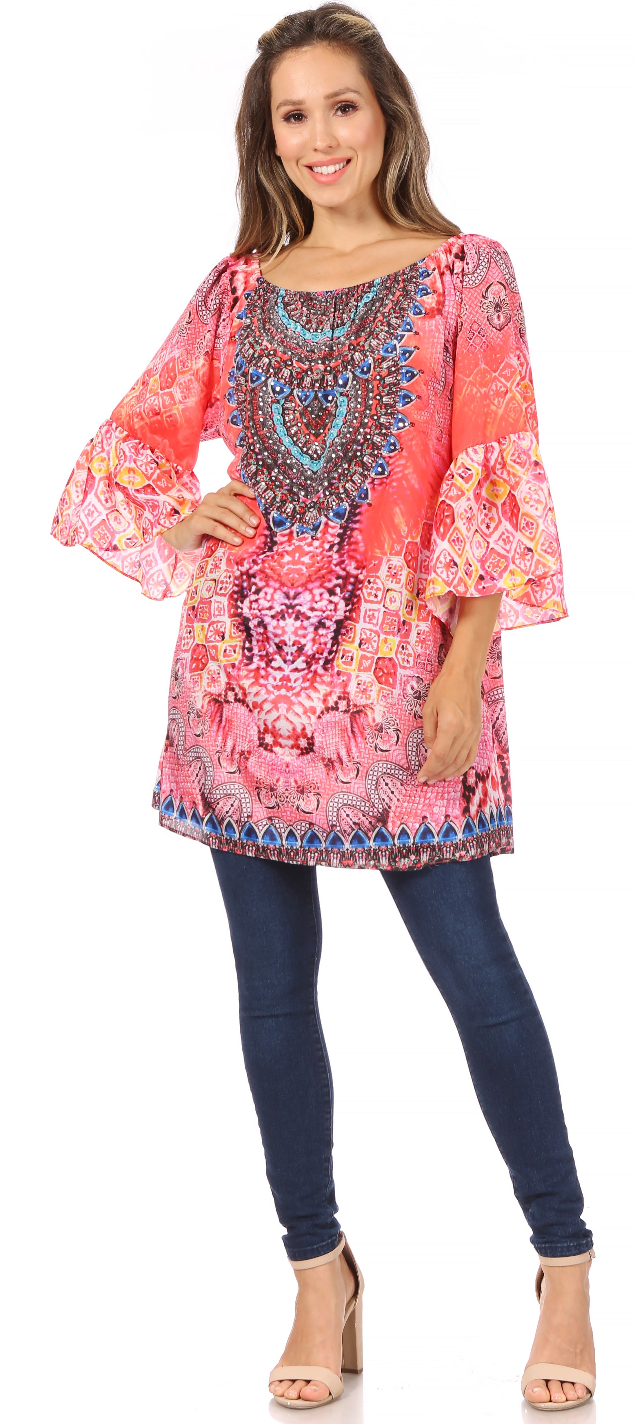 Woman wearing a colorful patterned dress with bell sleeves on a white background