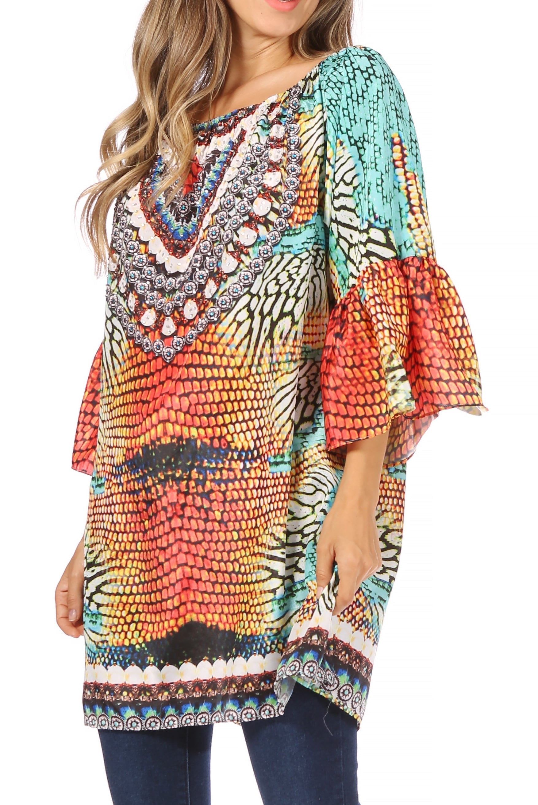 Colorful patterned blouse with ruffled sleeves worn by a person on a white background