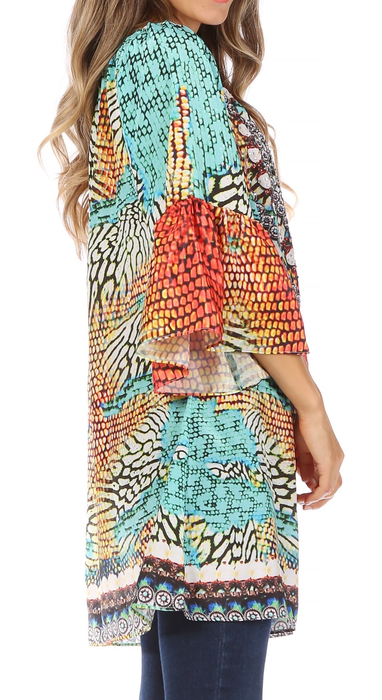 Colorful patterned top worn by a person on a white background