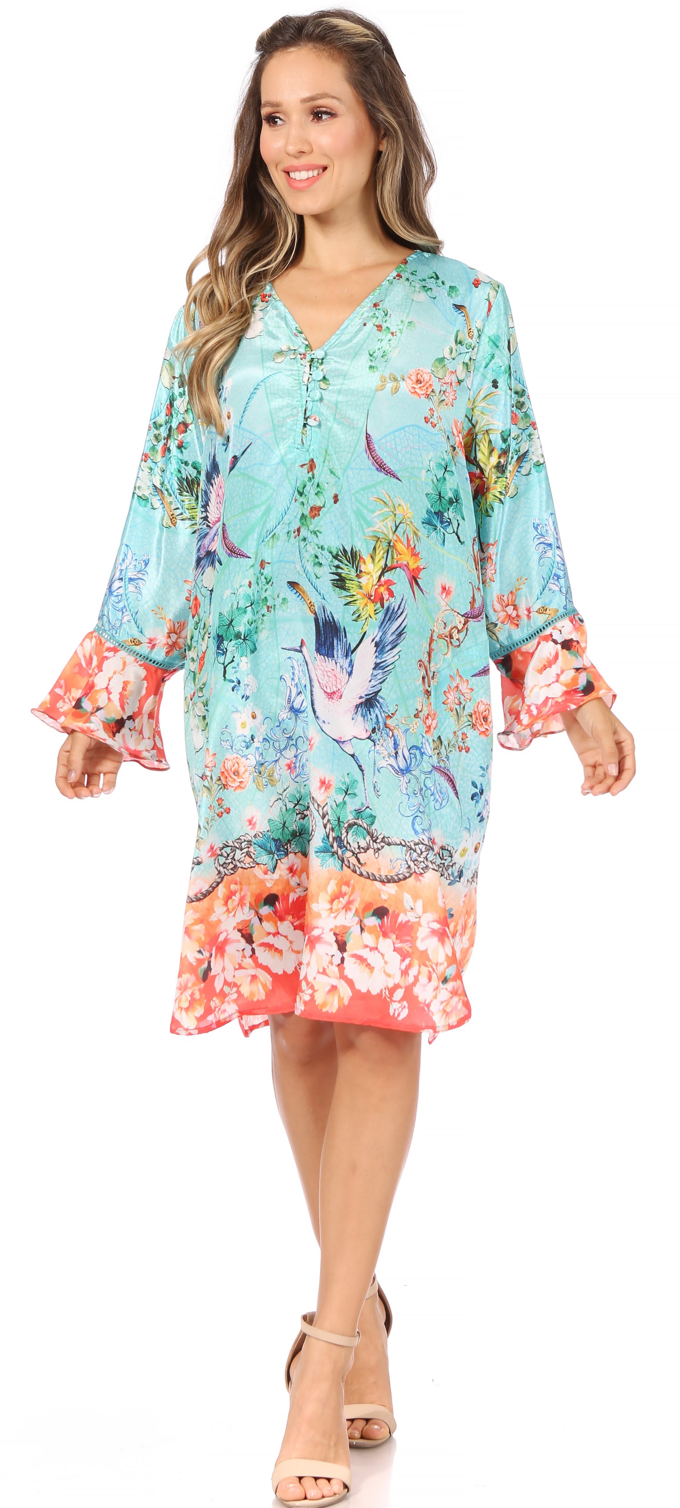 Woman wearing a colorful floral dress on a white background