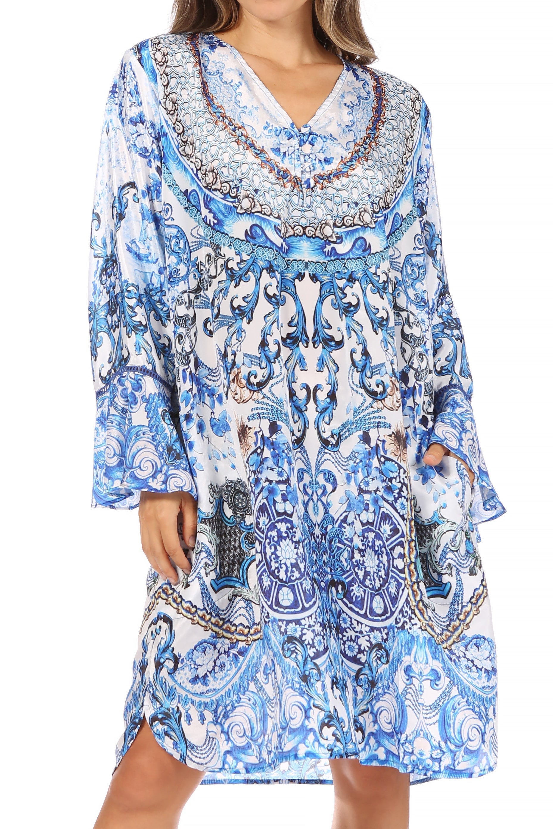 Blue and white patterned dress with long sleeves on a white background