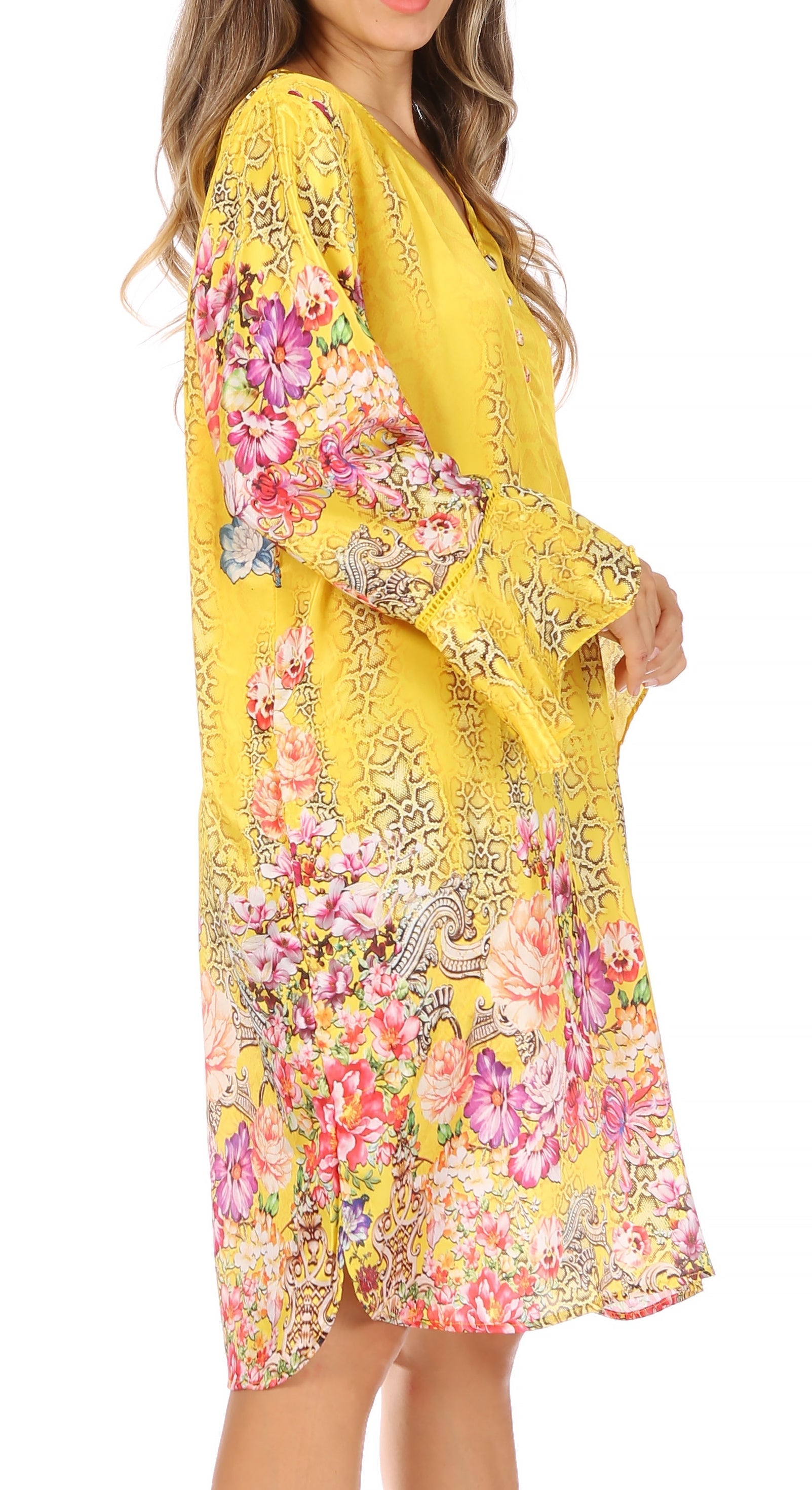 Yellow dress with floral and bird patterns on a white background
