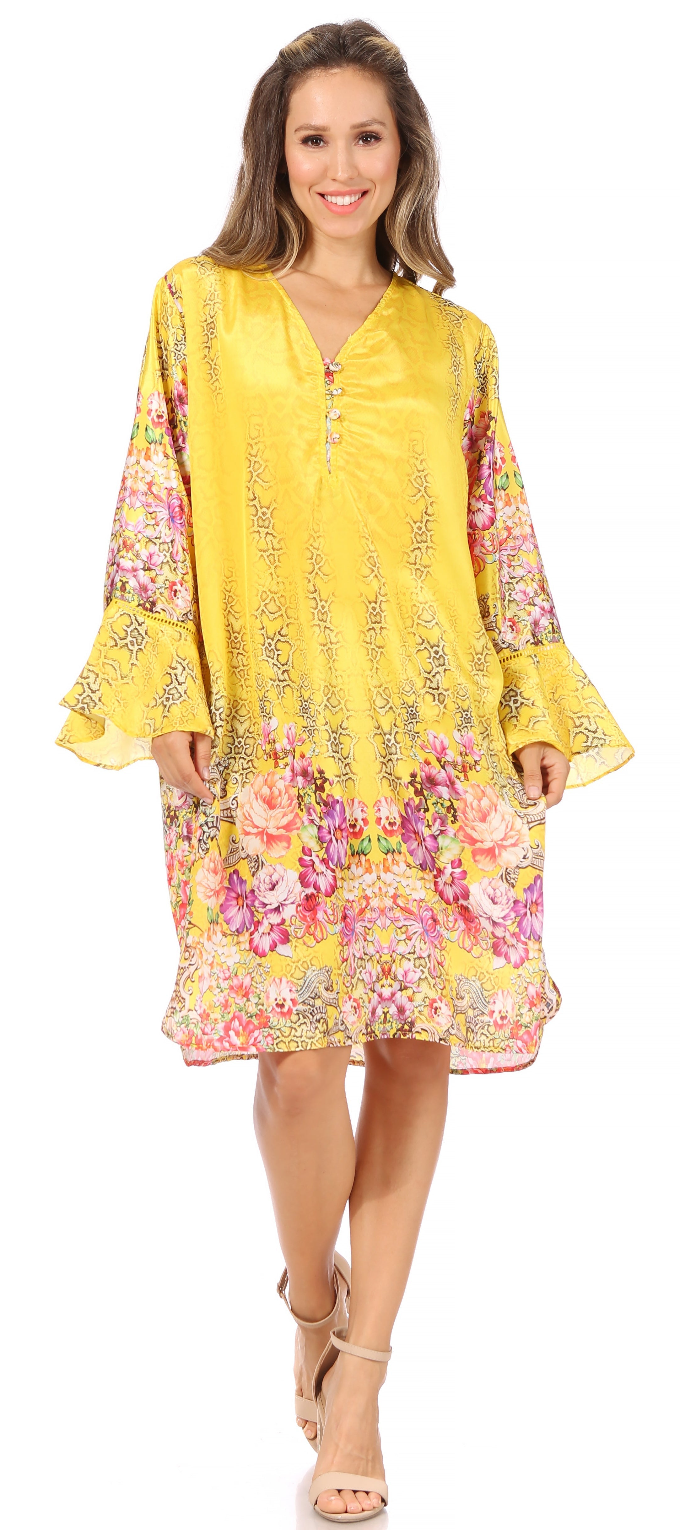 Woman wearing a yellow floral dress on a white background