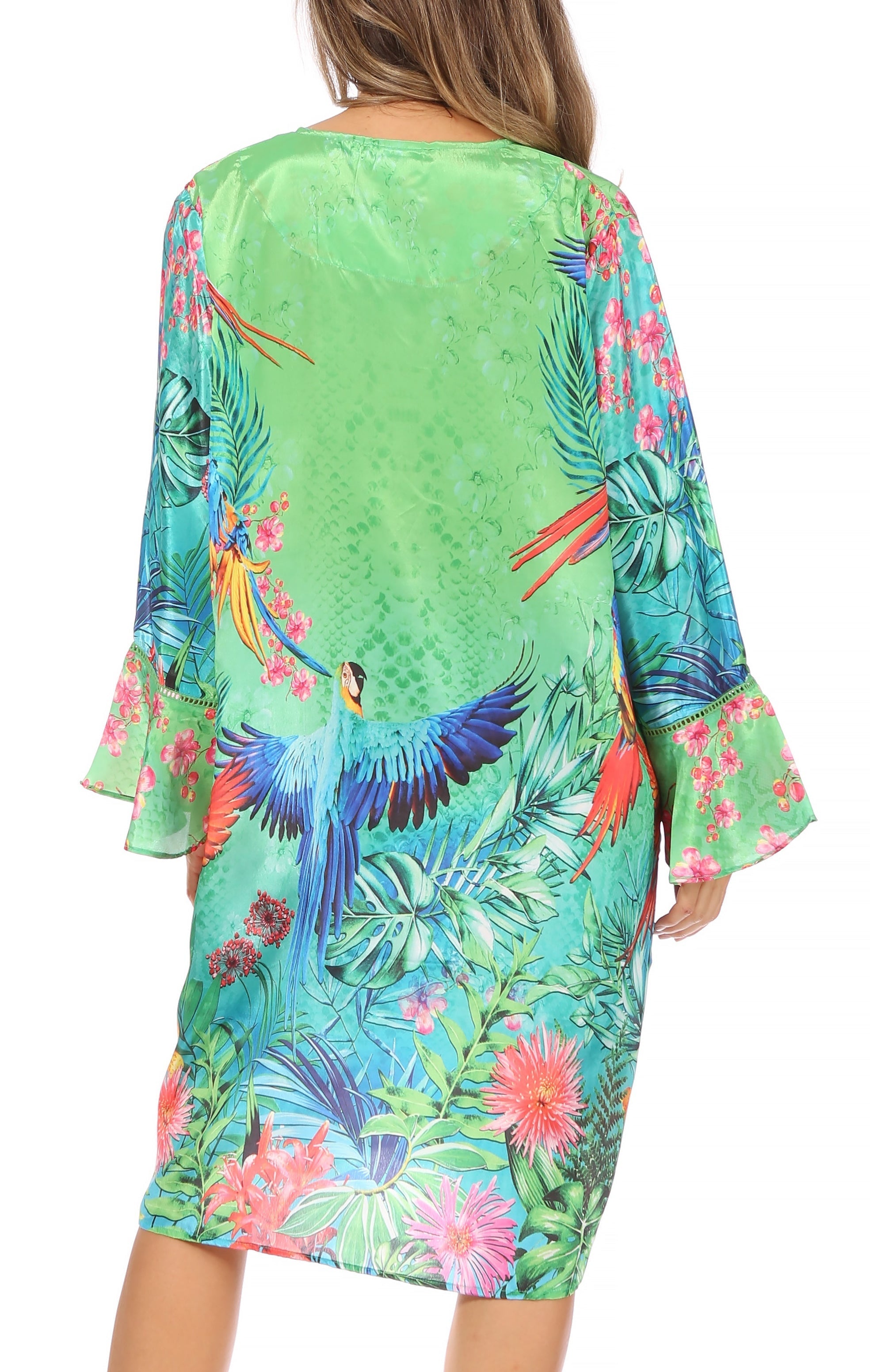 Green dress with colorful parrot and floral pattern on a white background