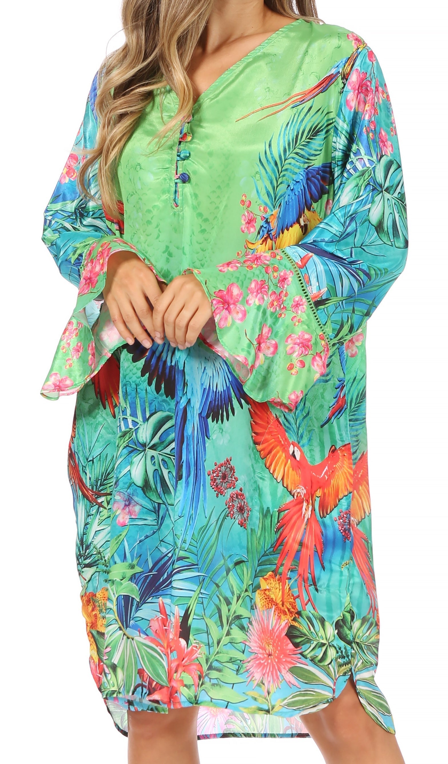 Woman wearing a colorful tropical print dress with parrot and floral design.