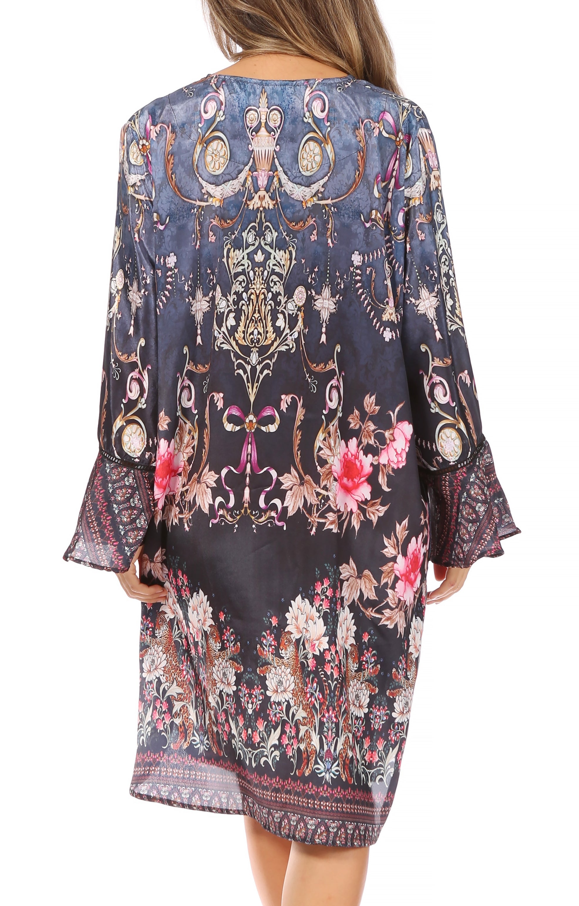 Floral and paisley patterned dress with bell sleeves on a white background