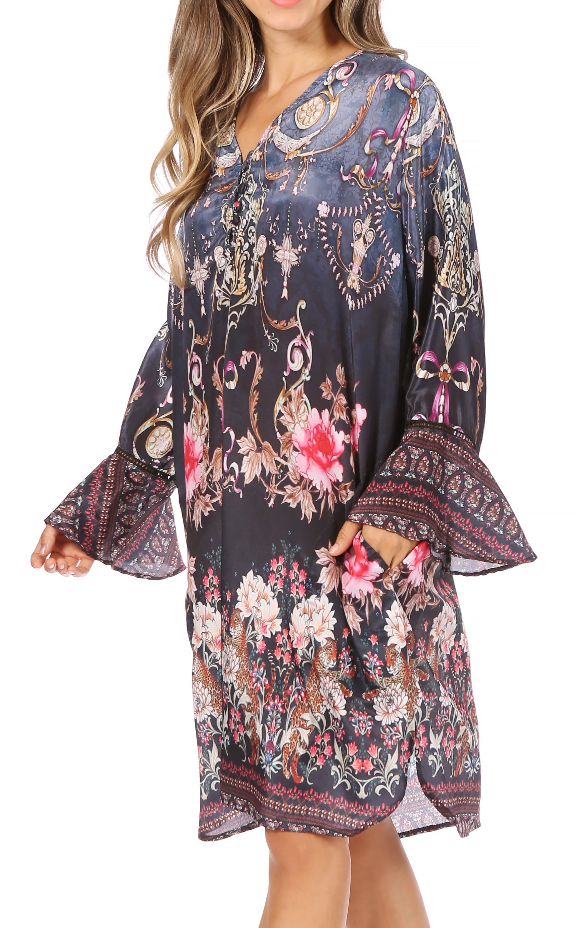 Floral and paisley patterned dress with bell sleeves on a white background