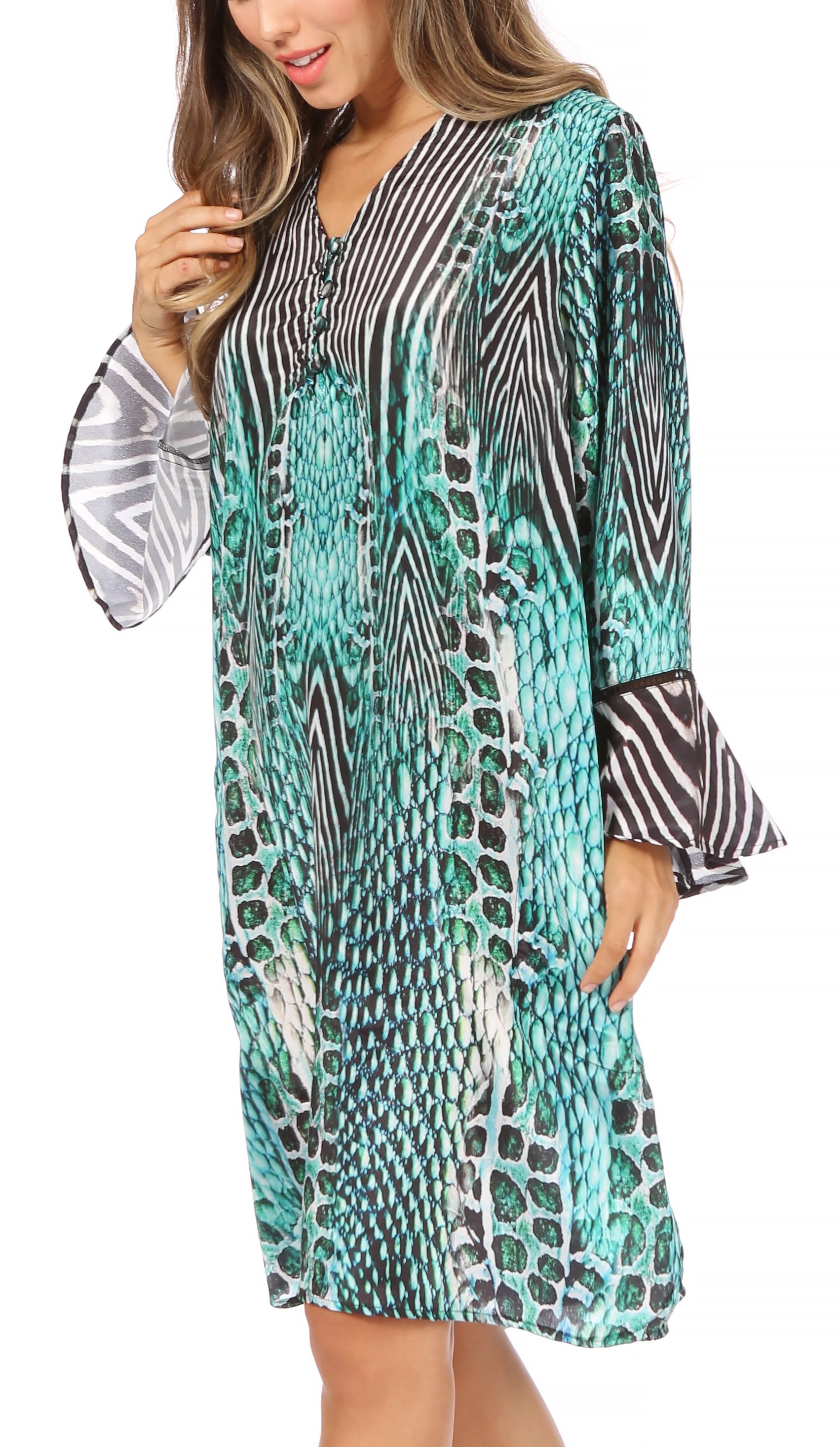 Woman wearing a patterned dress with bell sleeves on a white background