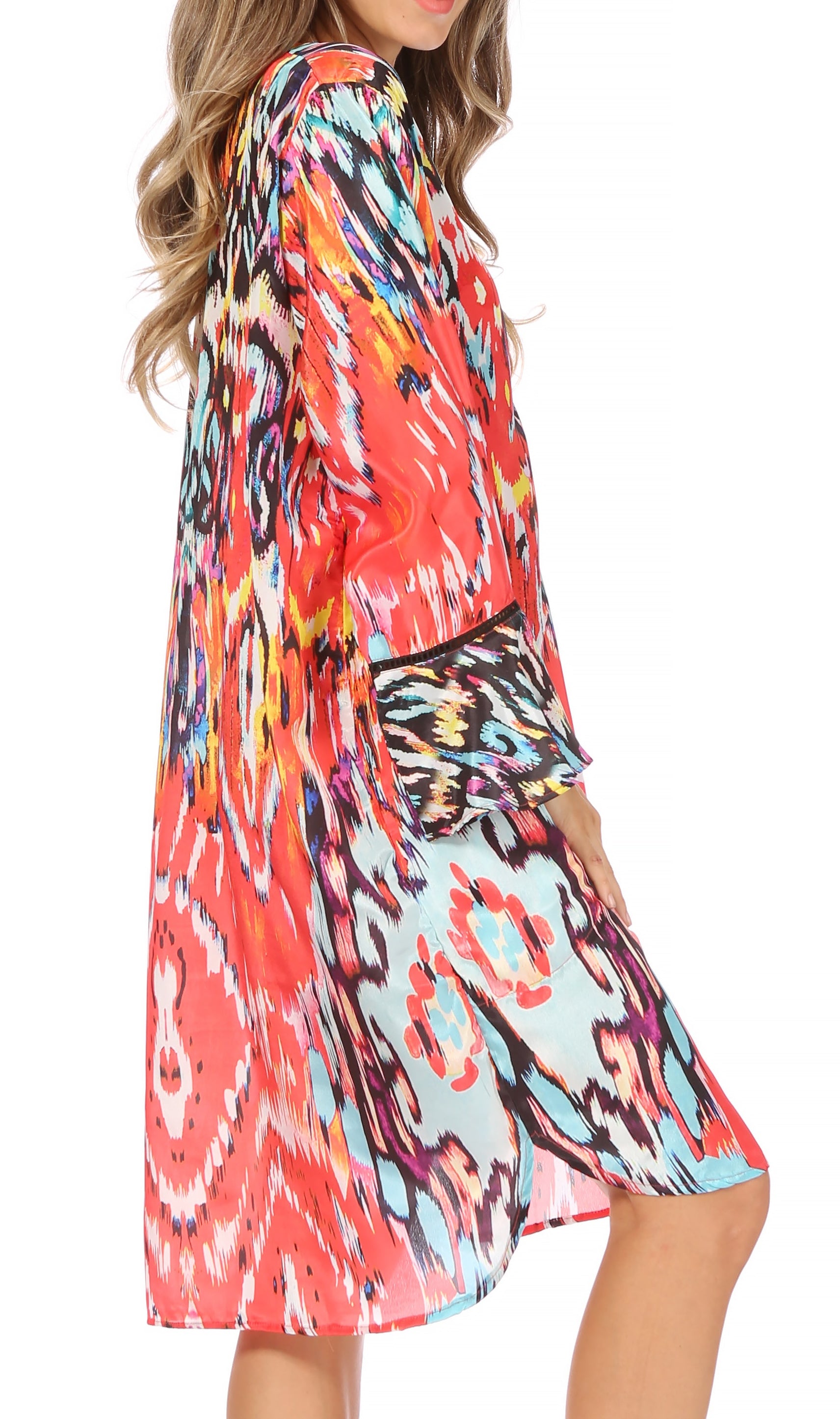 Colorful patterned dress worn by a model on a white background