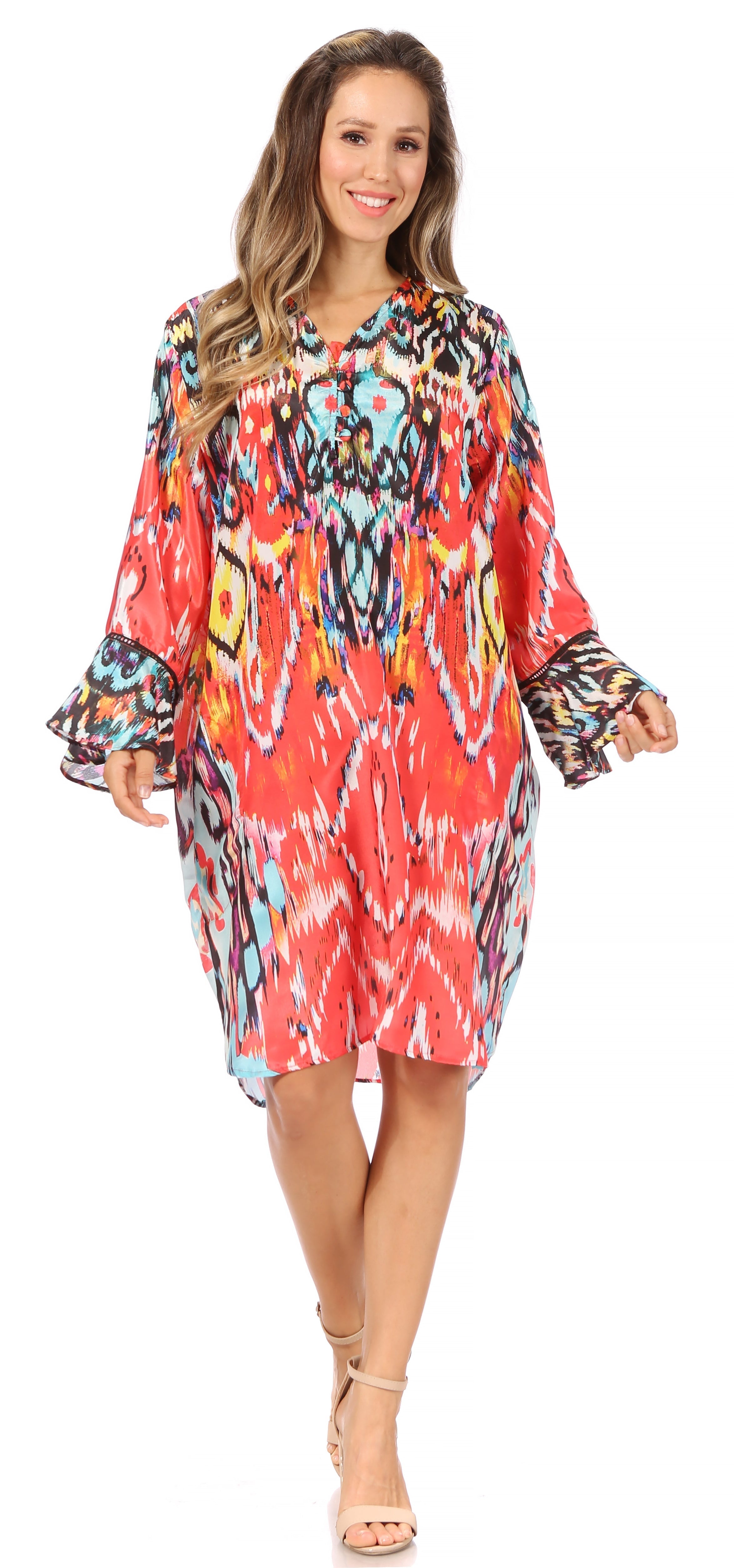 Woman wearing a colorful patterned dress on a white background