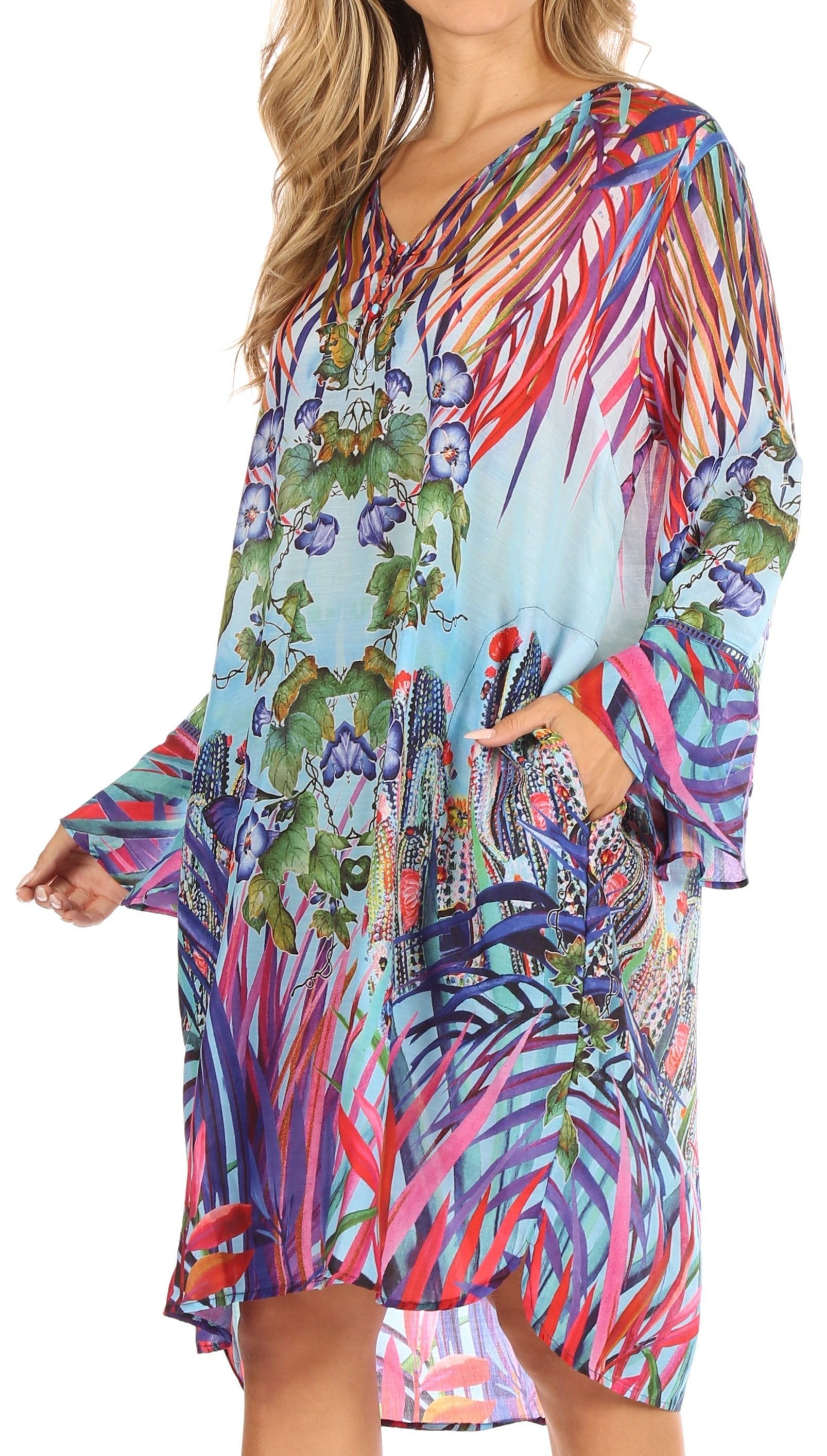 Woman wearing a colorful tropical print dress on a white background