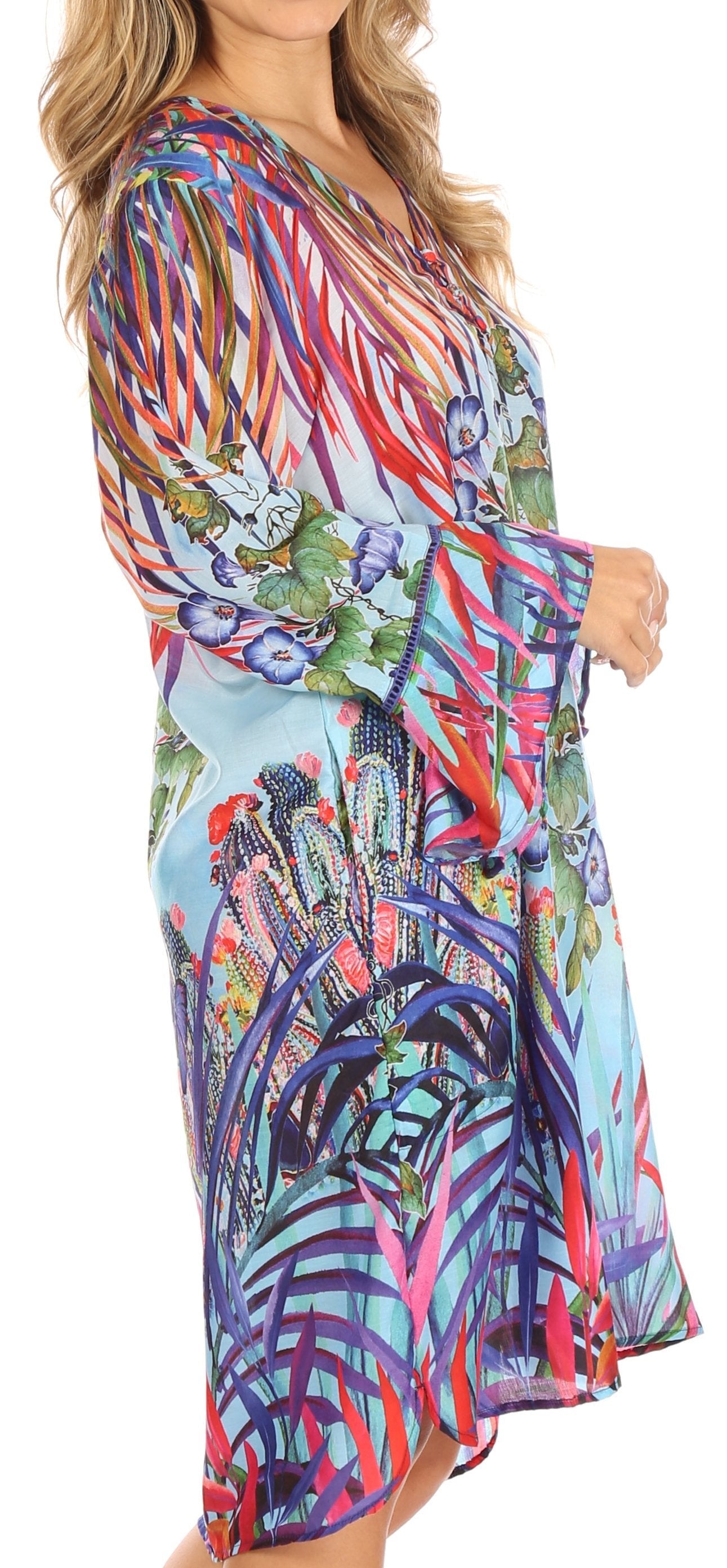 Colorful patterned dress worn by a model on a white background