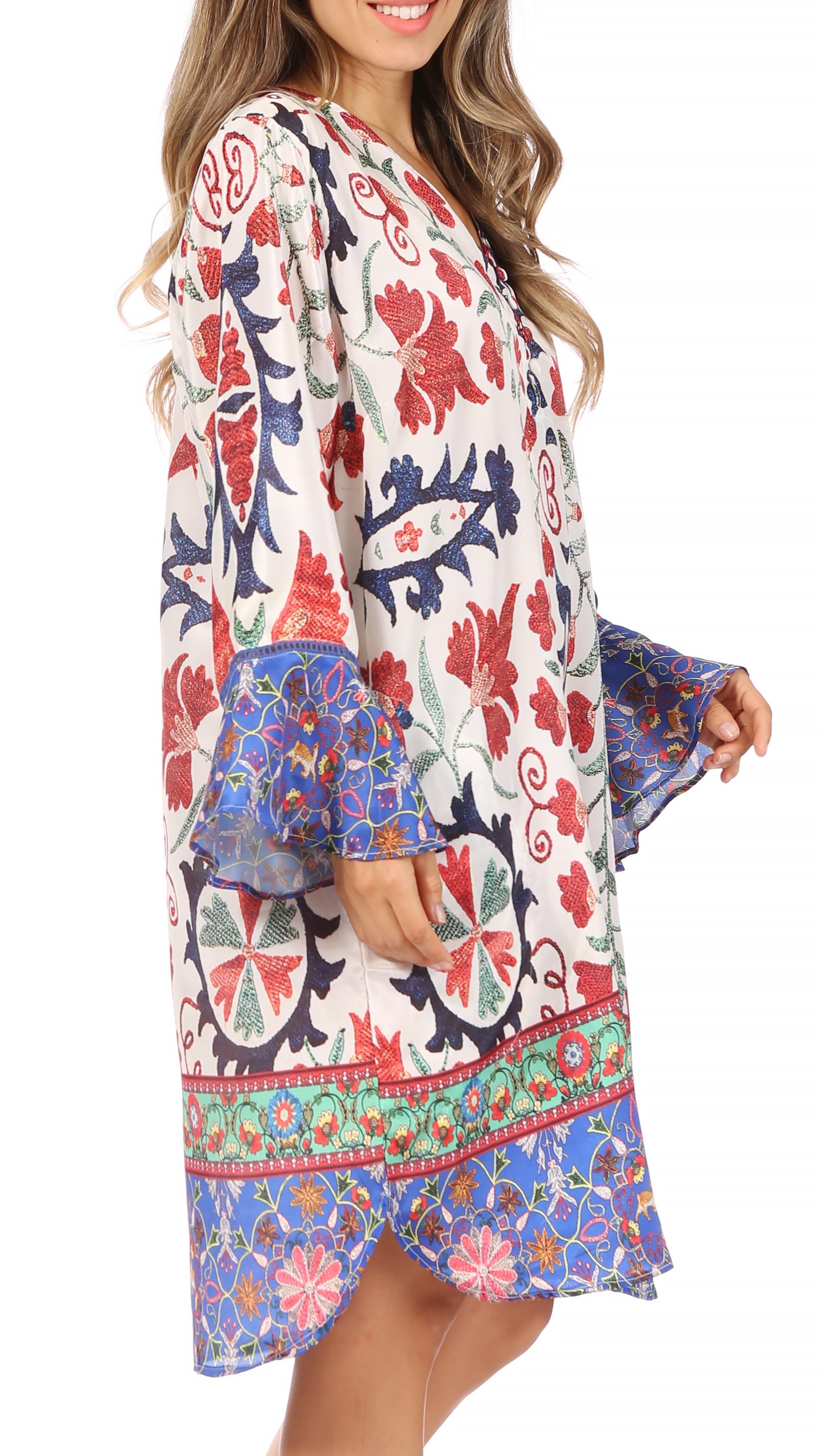 Woman wearing a colorful floral dress with a white background