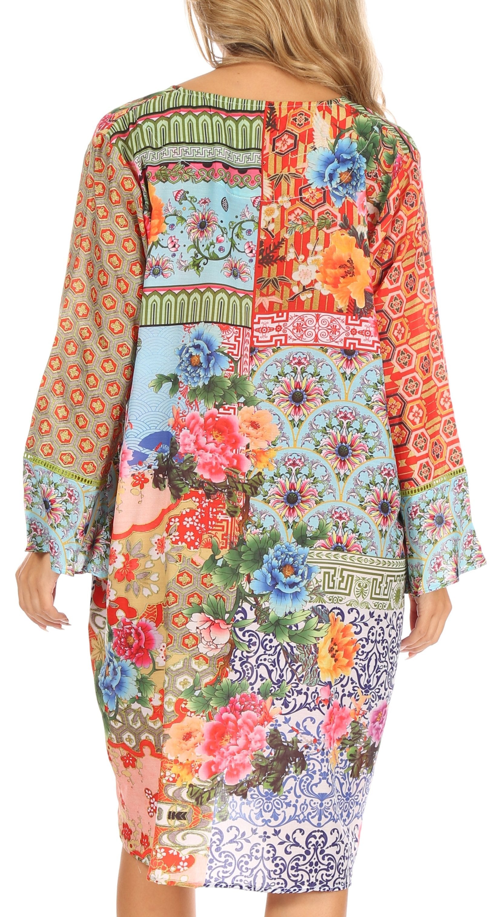 Colorful patterned dress with floral and geometric designs on a white background