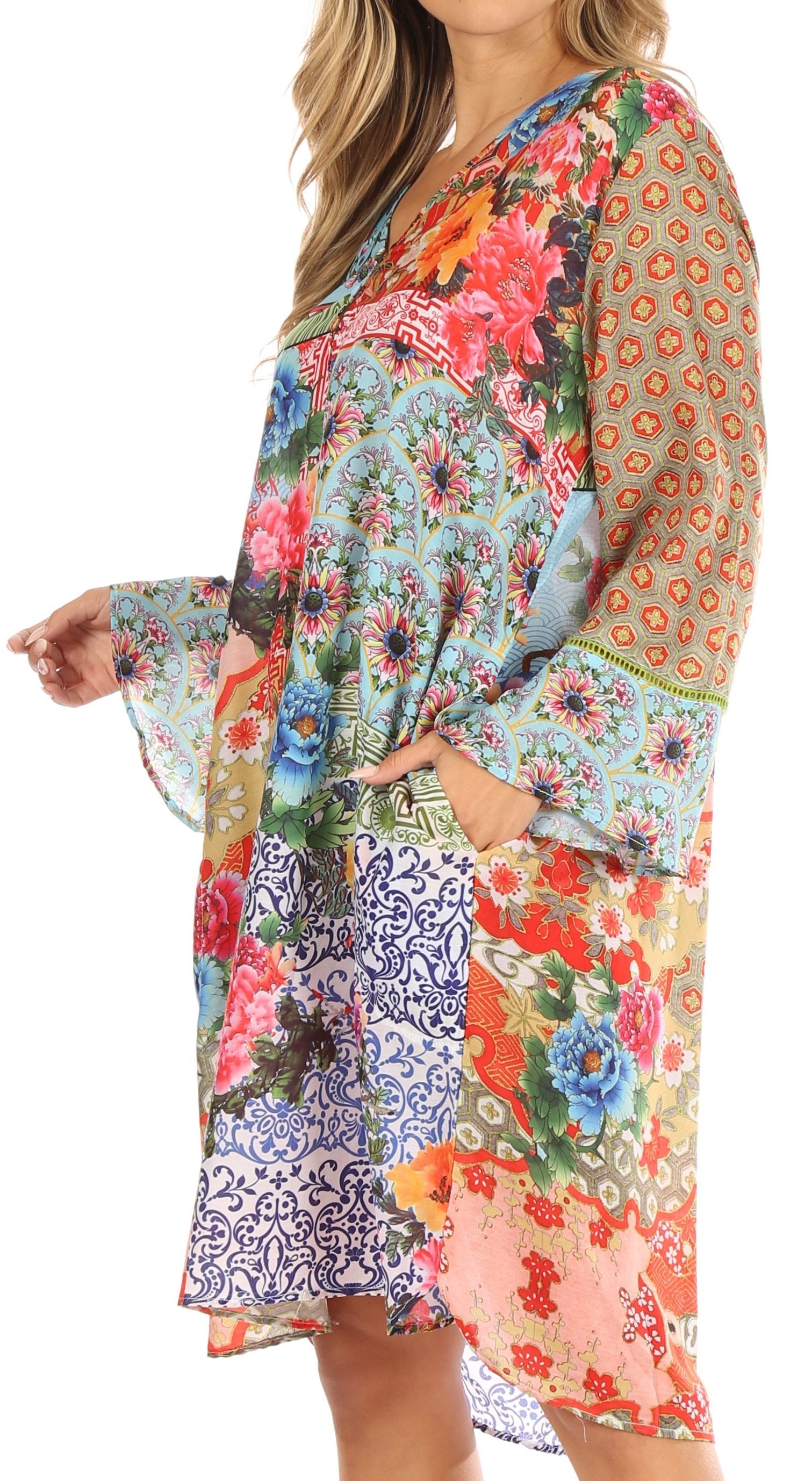 Multicolored floral and patterned dress with bell sleeves on a white background