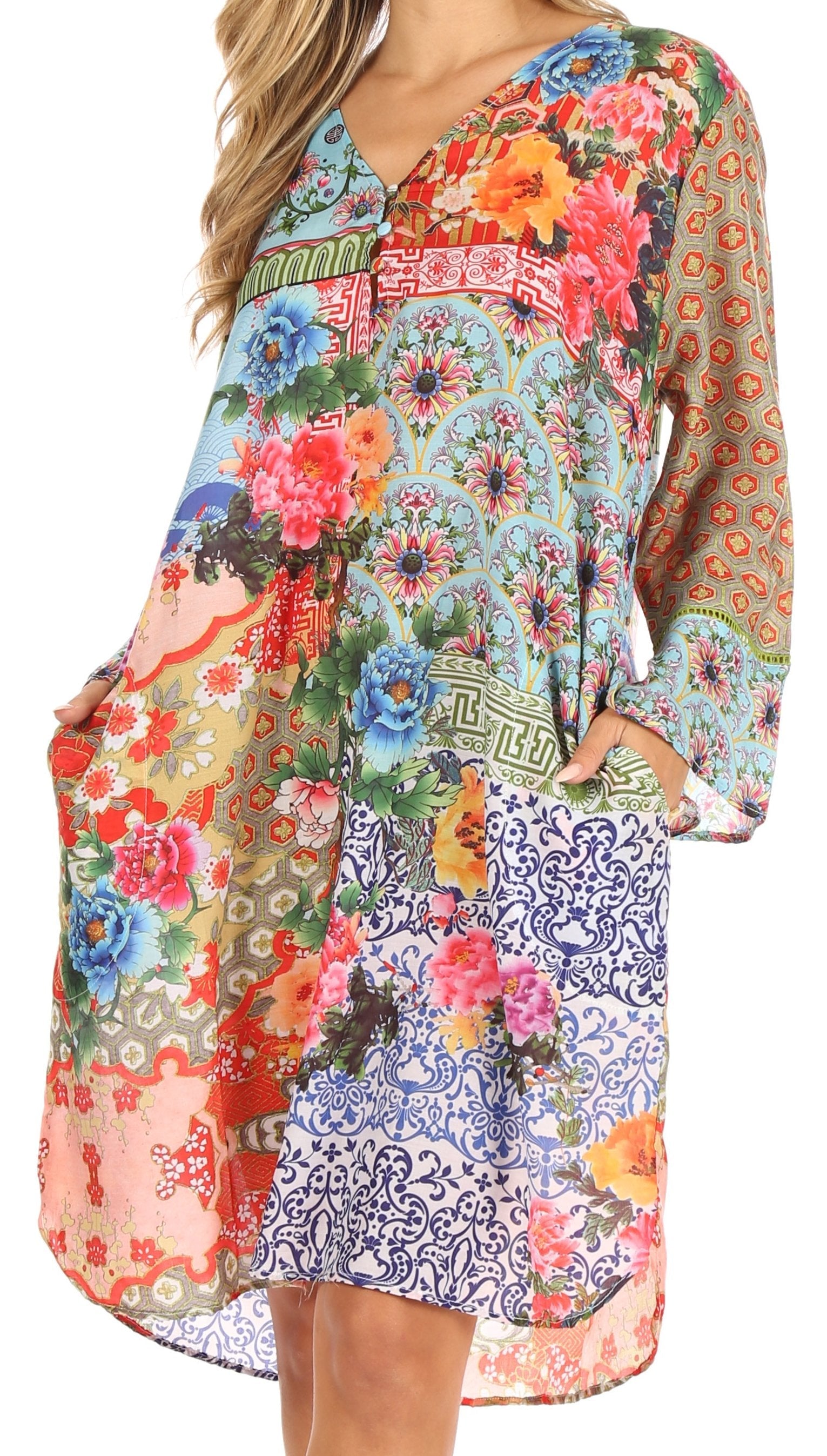 Colorful floral and geometric patterned dress with long sleeves on a white background