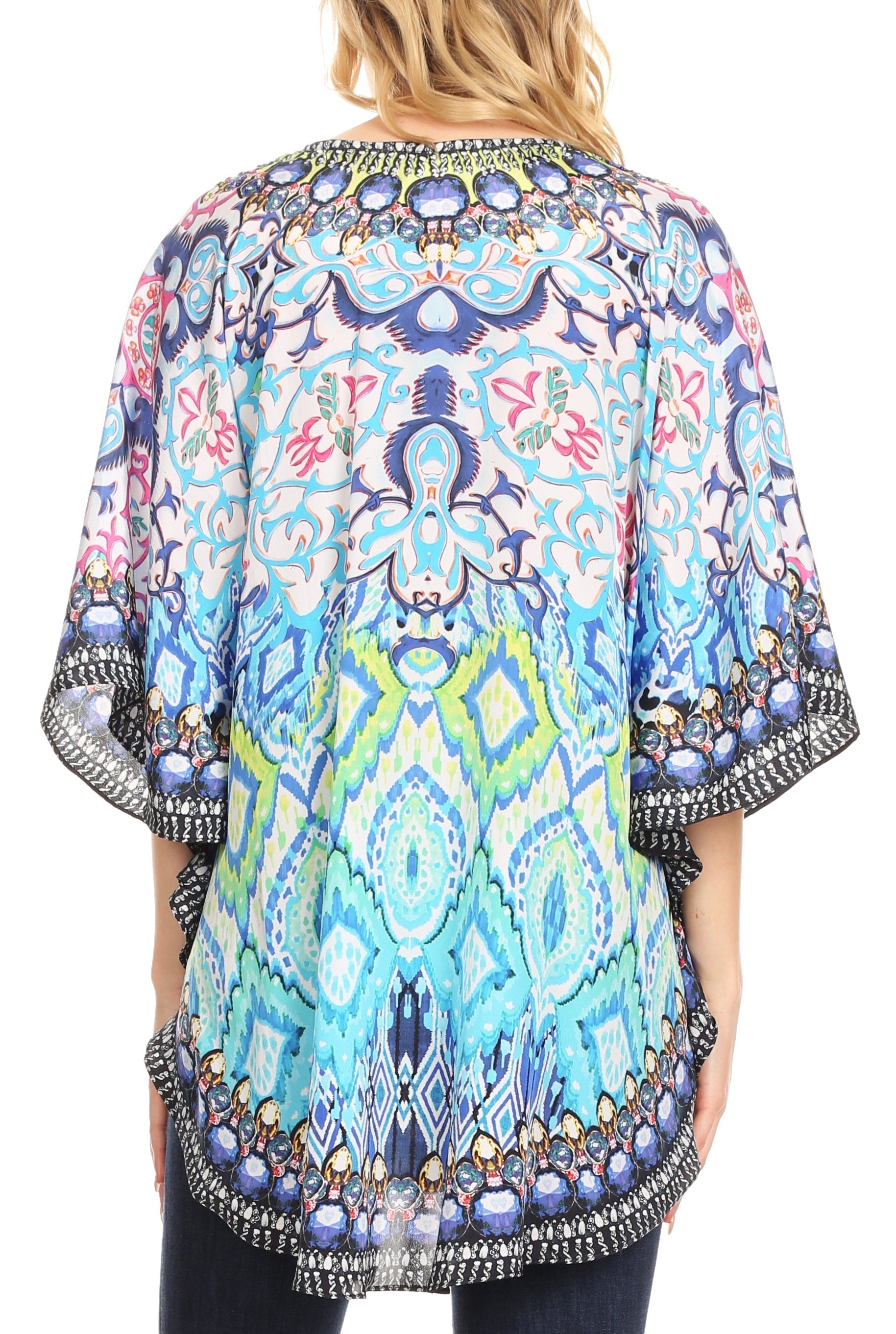 Colorful patterned kimono-style top worn by a person on a white background