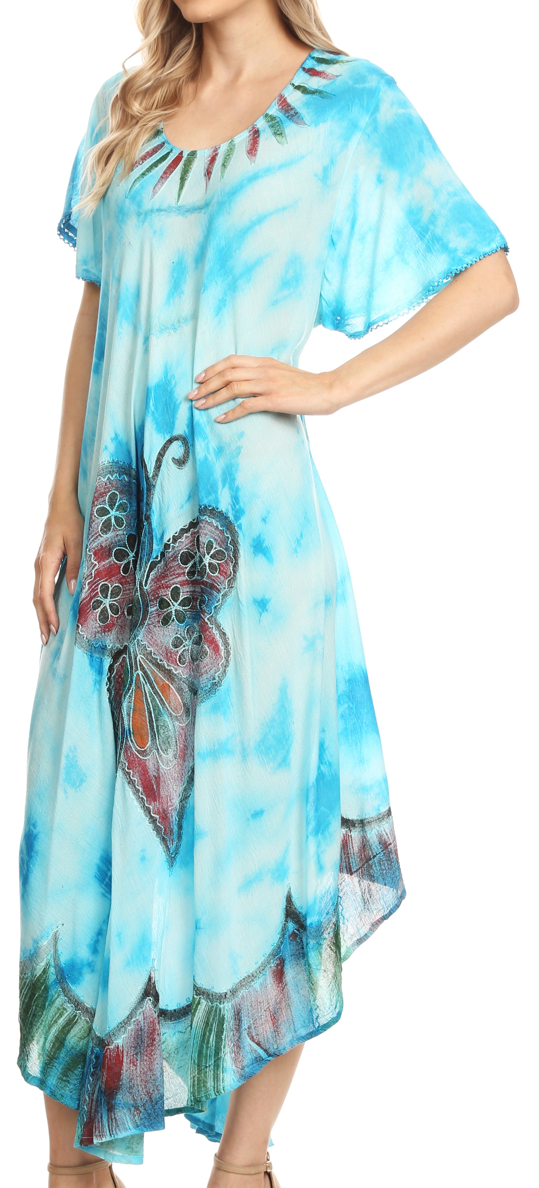 Woman wearing a blue floral dress with a butterfly design.