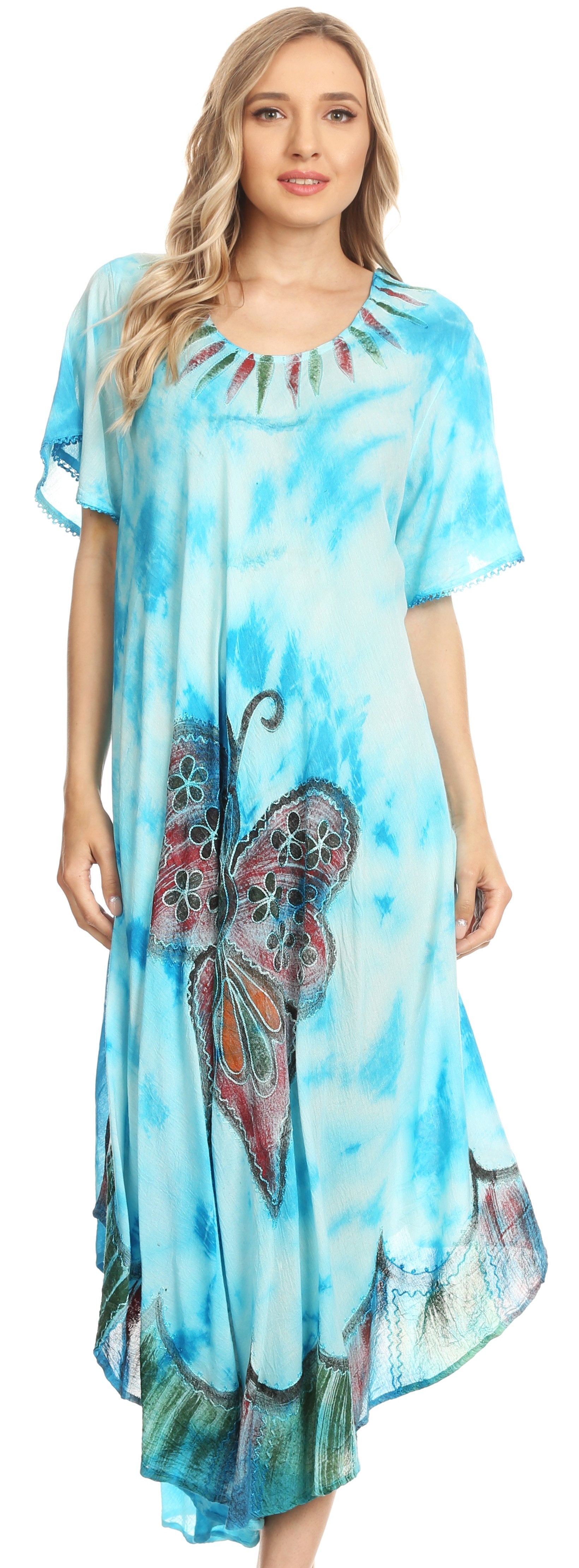 Woman wearing a blue tie-dye dress with butterfly design on a white background