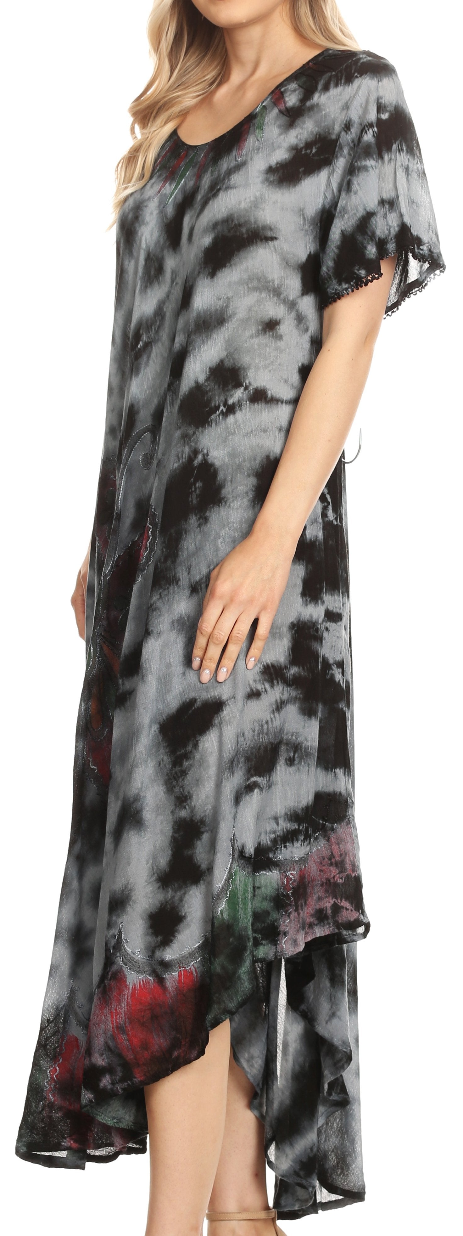Woman wearing a tie-dye dress with black, gray, and red patterns.