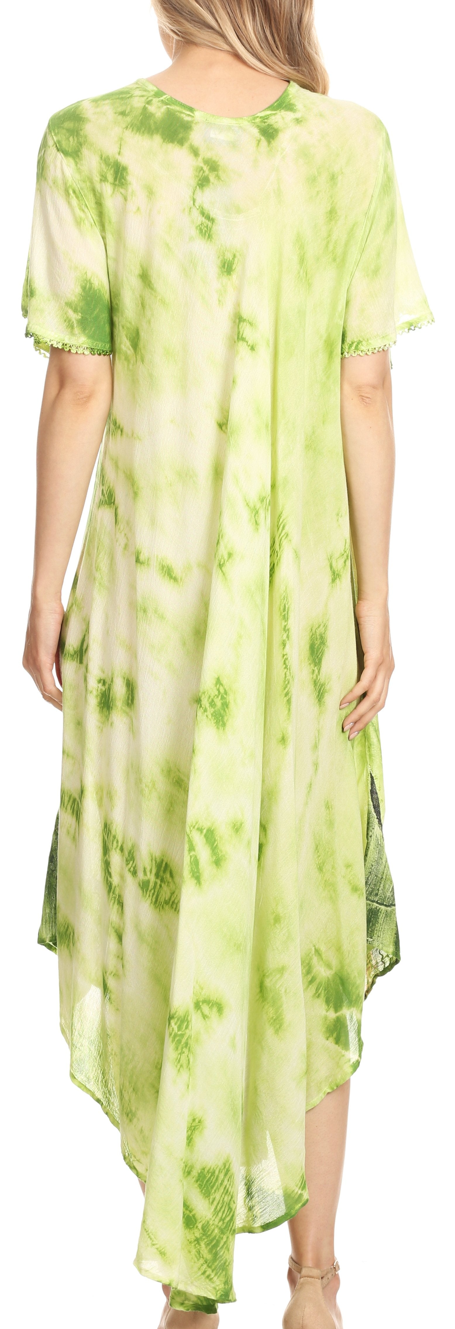 Woman wearing a green tie-dye dress with a blurred background