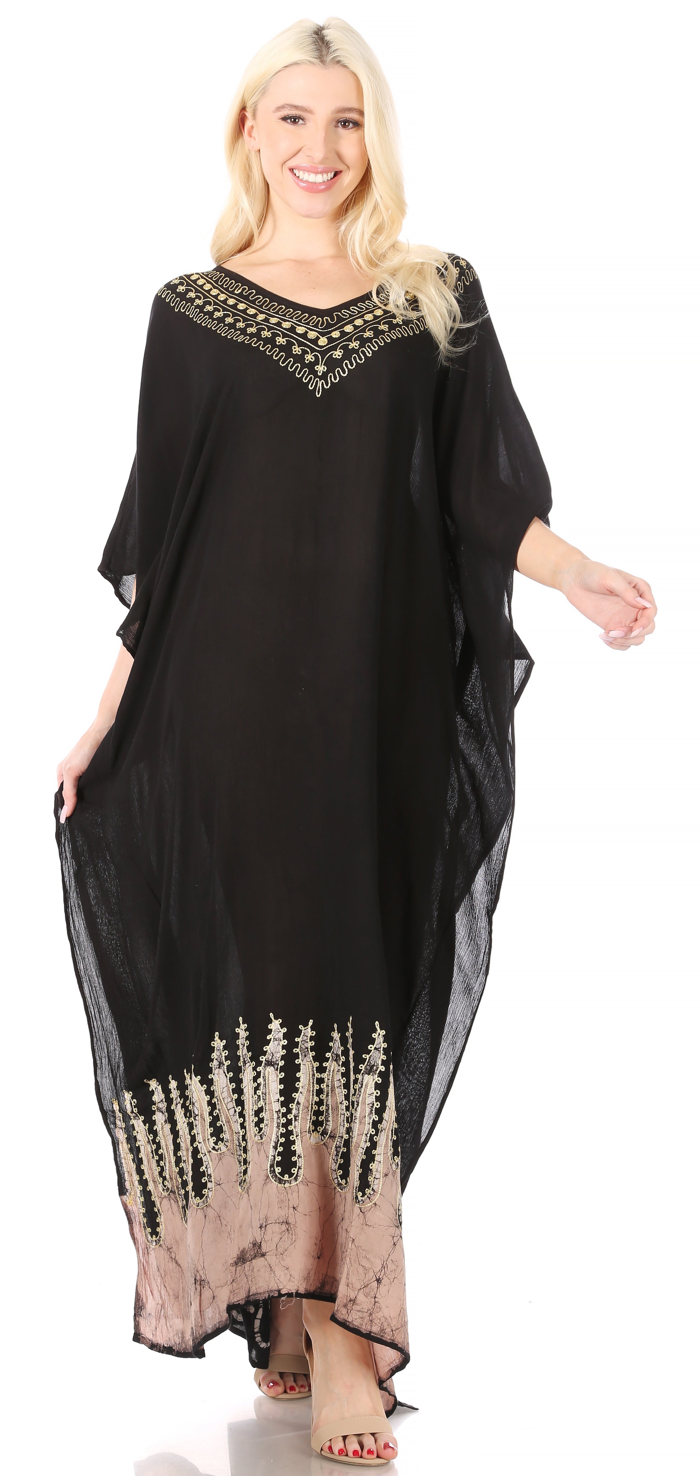 Woman wearing a black dress with decorative patterns on a white background
